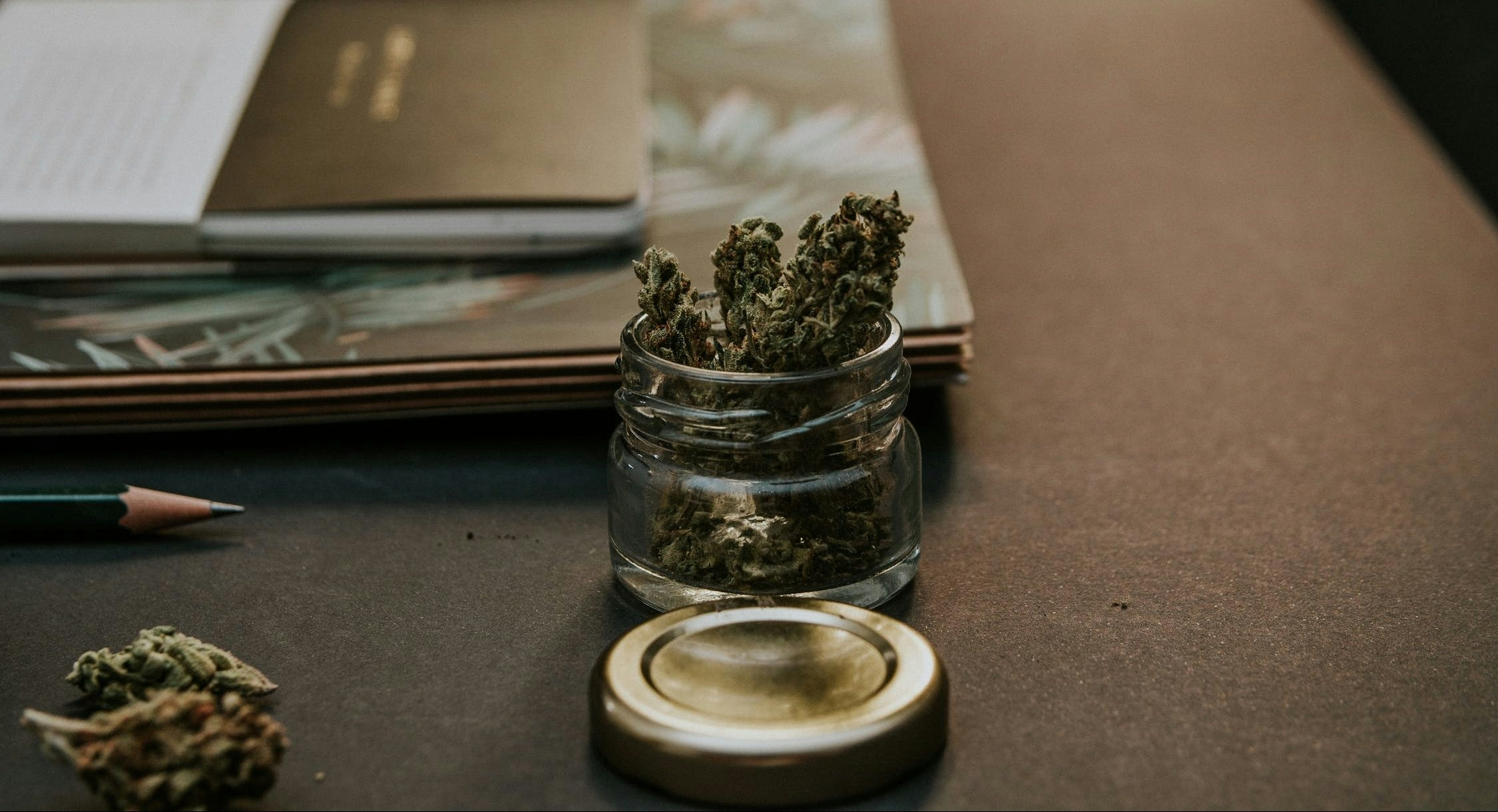 Glass jar filled with premium cannabis buds
