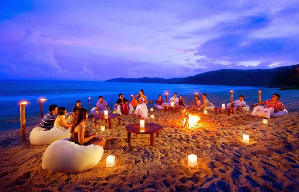 a group of people on the beach of antigua enjoing some weed