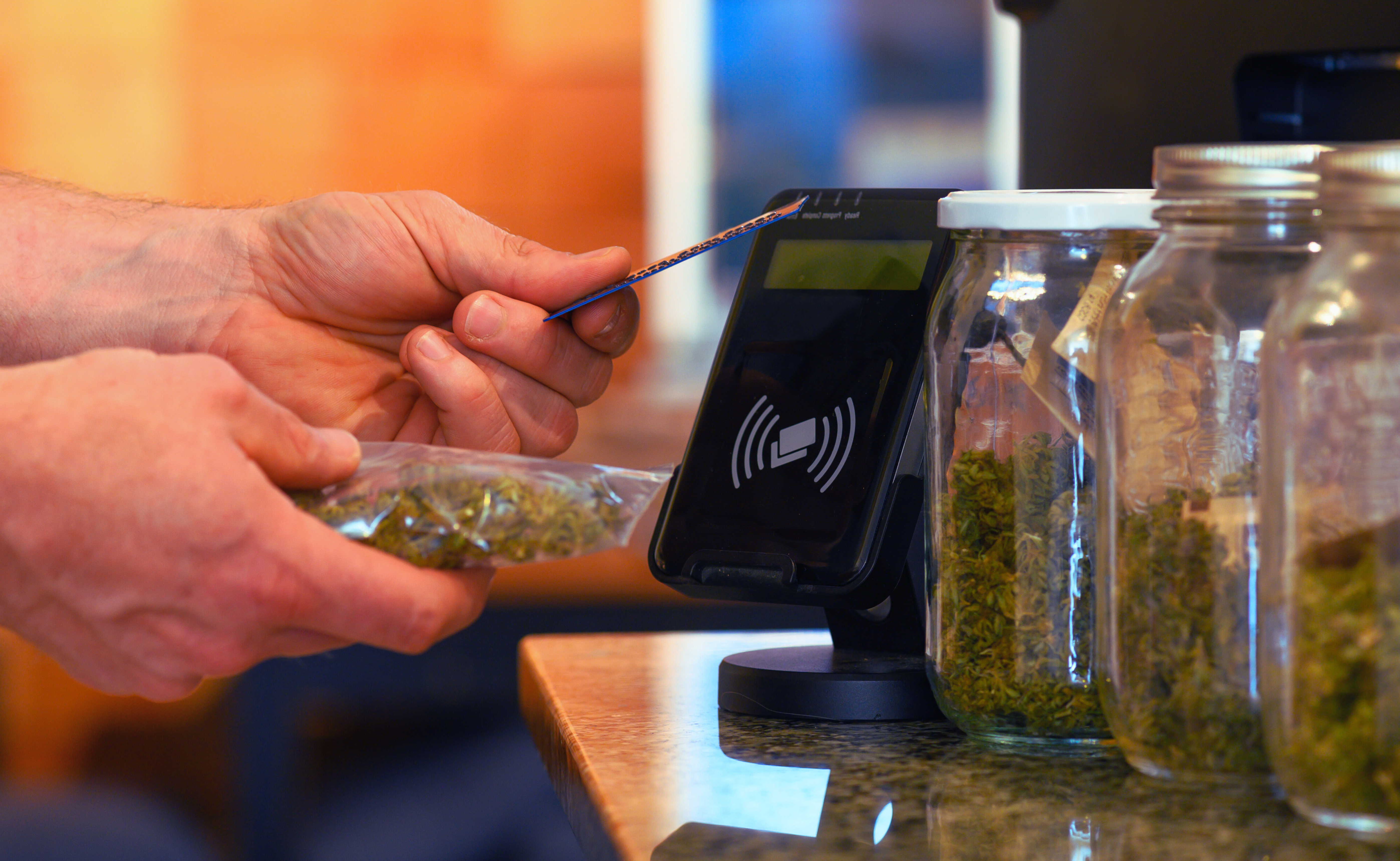 Customer purchasing cannabis products at a licensed dispensary