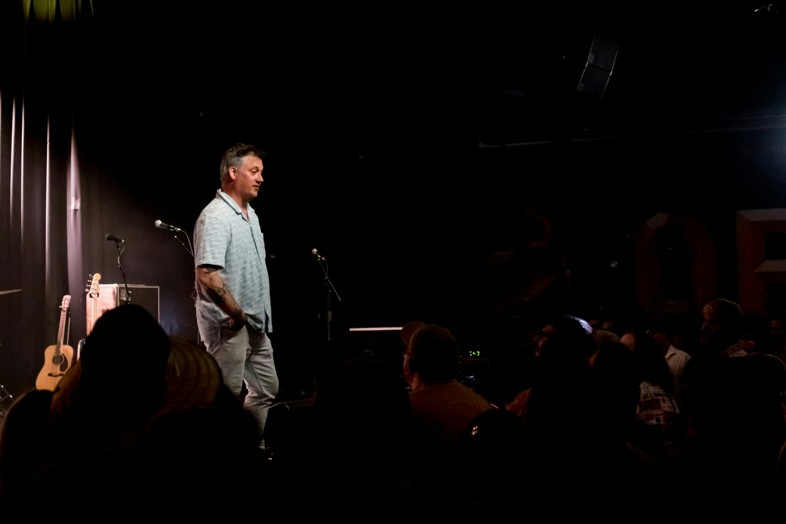 Man standing on a stage in front of a crowd