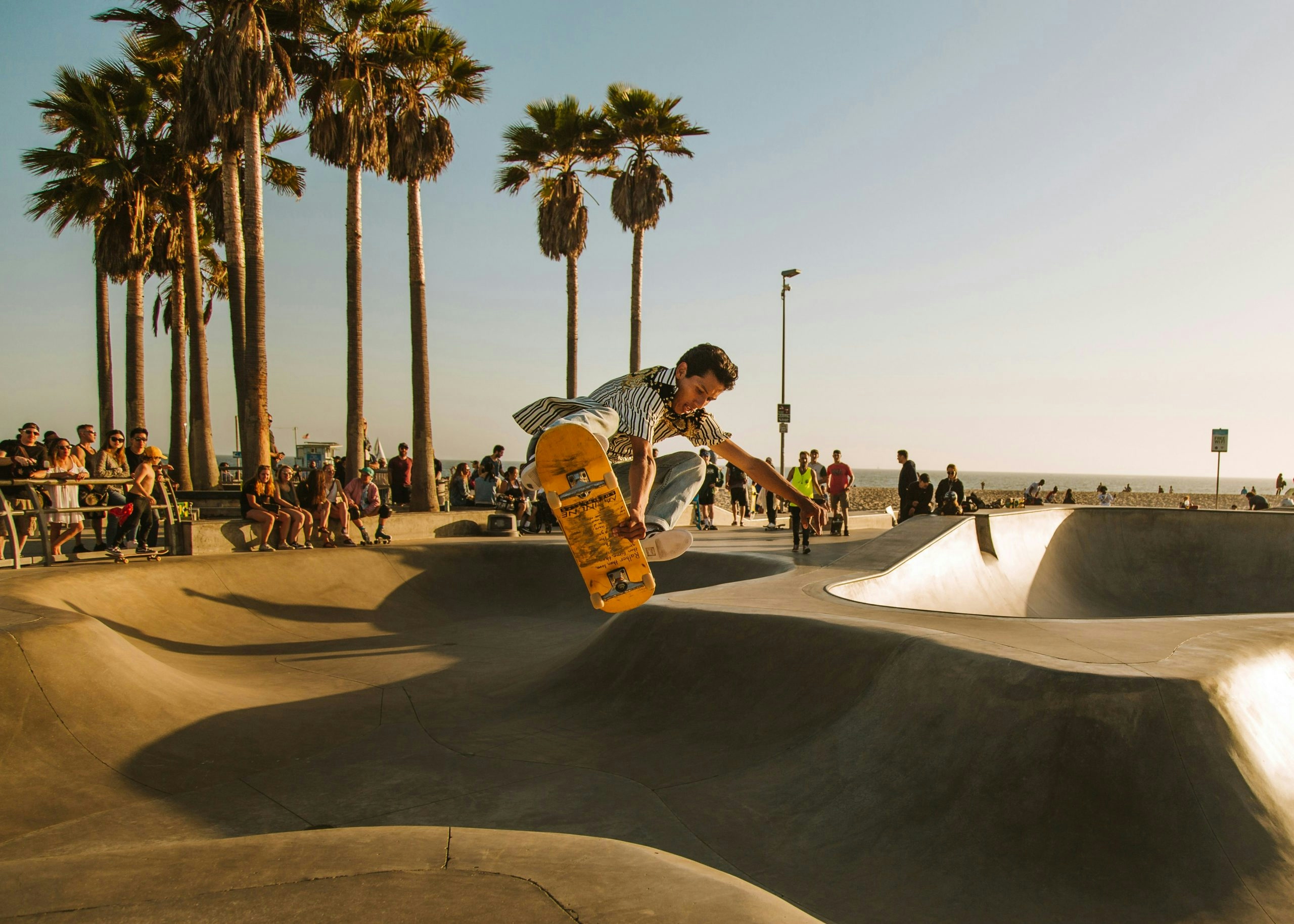 time-lapse photo of man riding skateboard at skate park