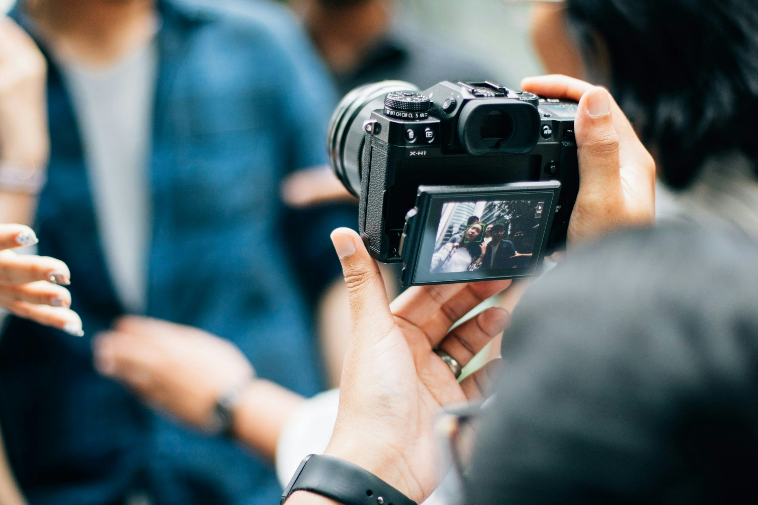 Photographer taking photos with a professional camera during a photo shoot