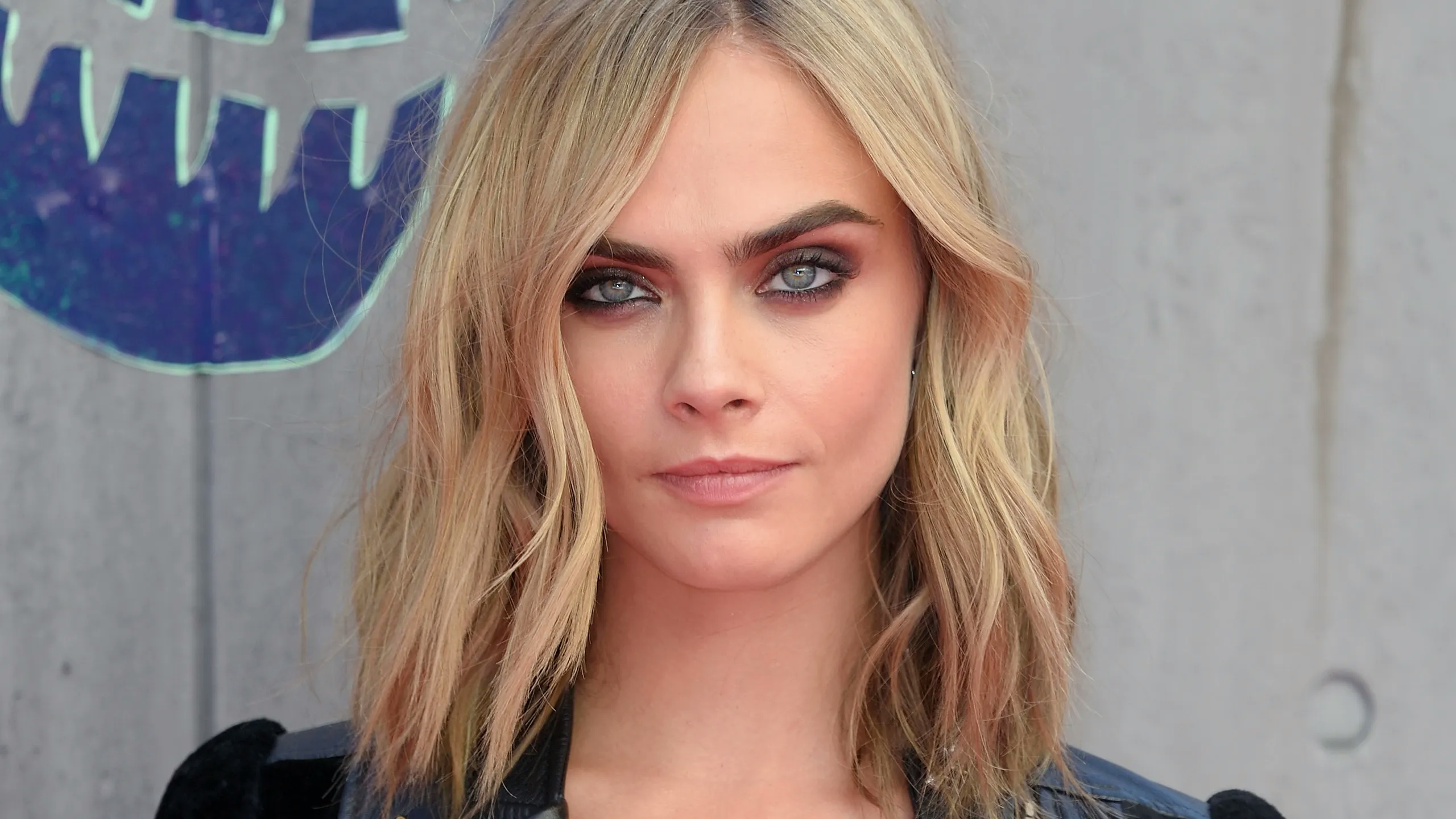 Cara Delevingne posing confidently in front of the camera