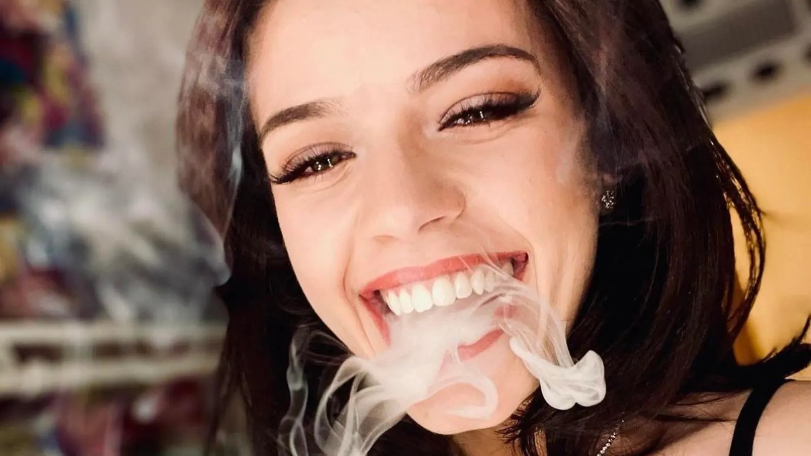 Koala Puffs, the streamer, with a cloud of smoke coming from her mouth