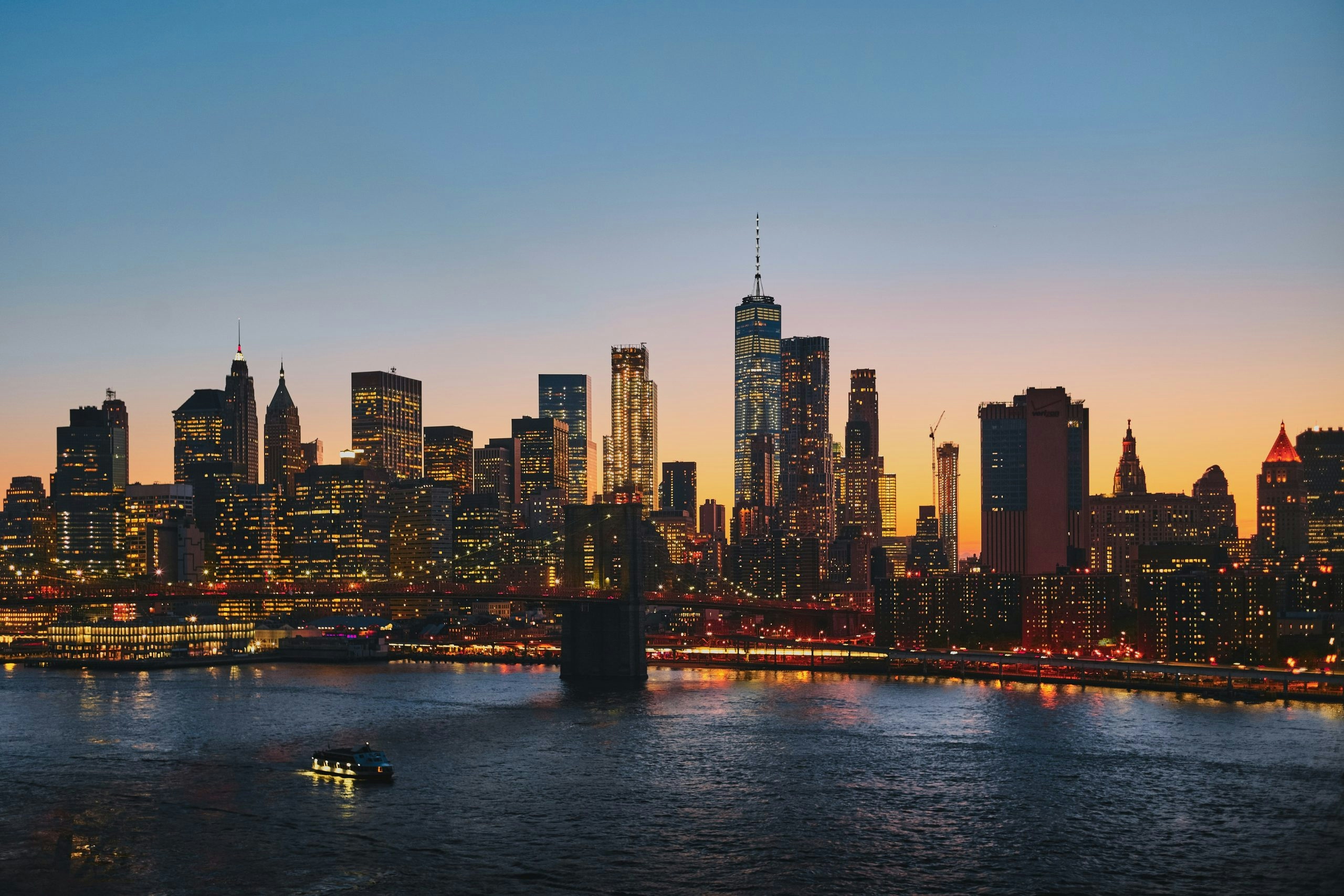 Panoramic view of the New York City skyline during a colorful sunset