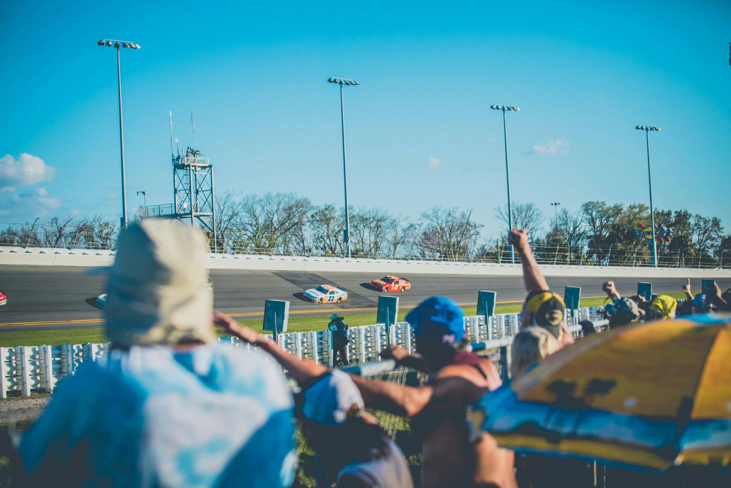 Fans cheering during a NASCAR race at the speedway