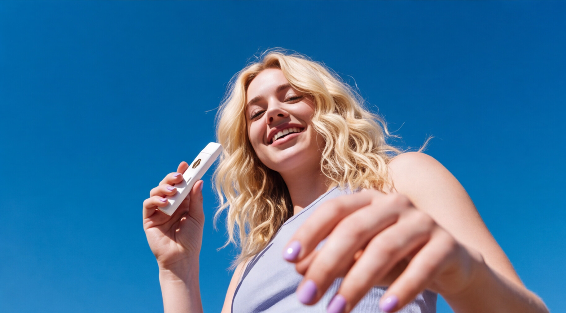 woman posing with a white vape in her hand