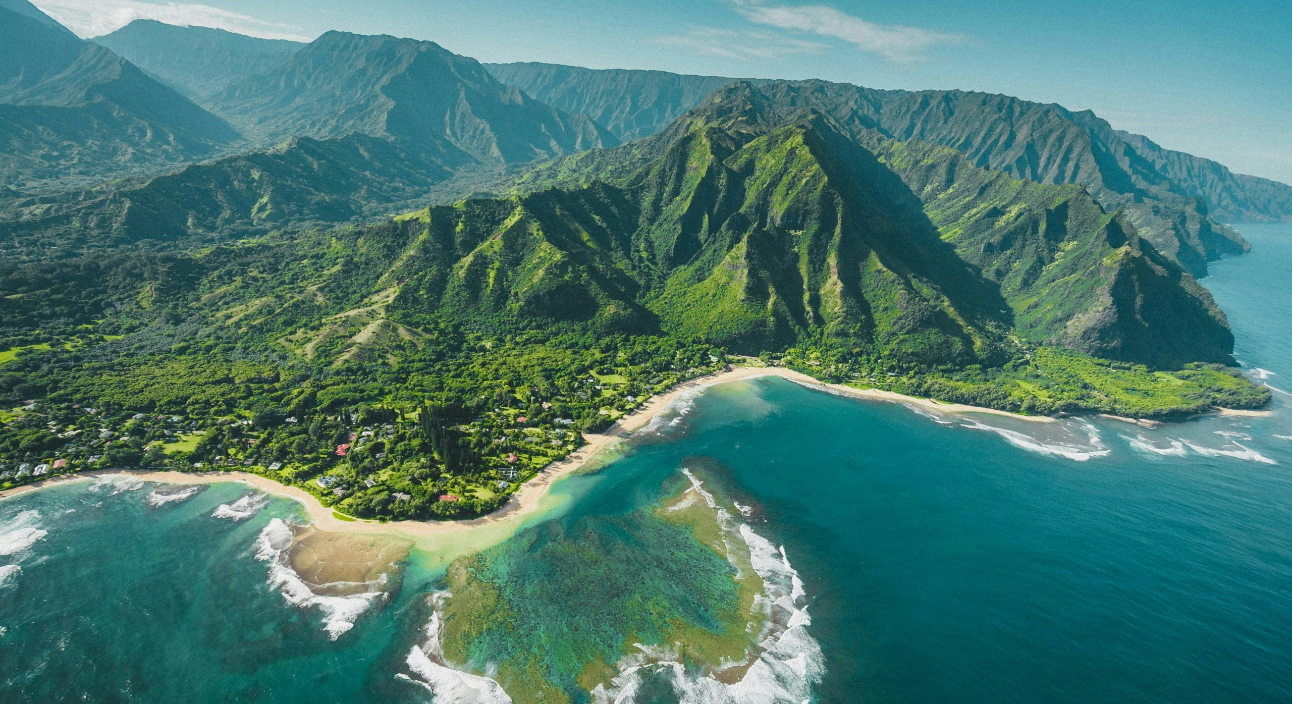 aerial view of hawaii's mountains and sea