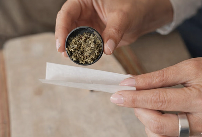 hands rolling a joint