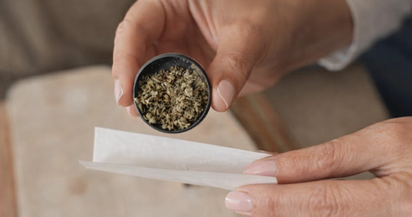 hands rolling a joint