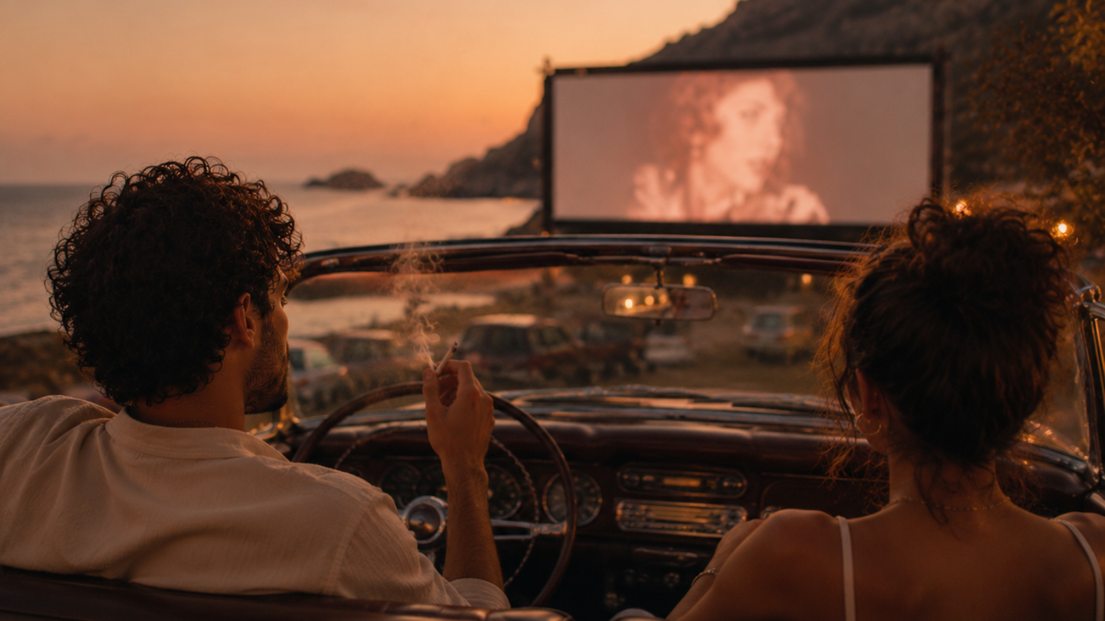 Vintage convertible passenger smoking cannabis beside illuminated outdoor movie screen