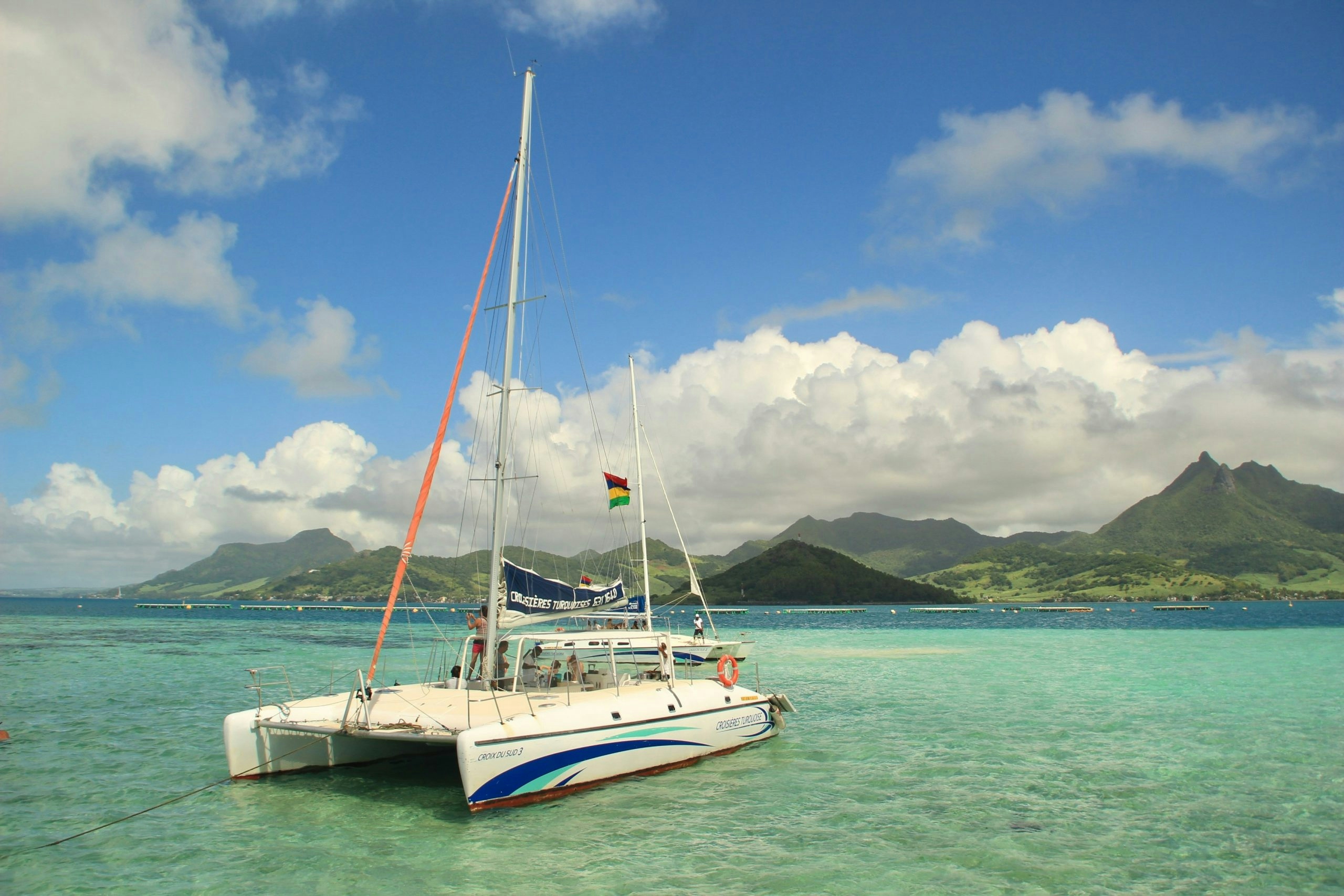 White sand beach in Mauritius with crystal-clear turquoise water and palm trees