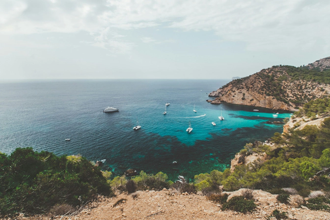 Mediterranean beach in Mallorca surrounded by dramatic coastal scenery
