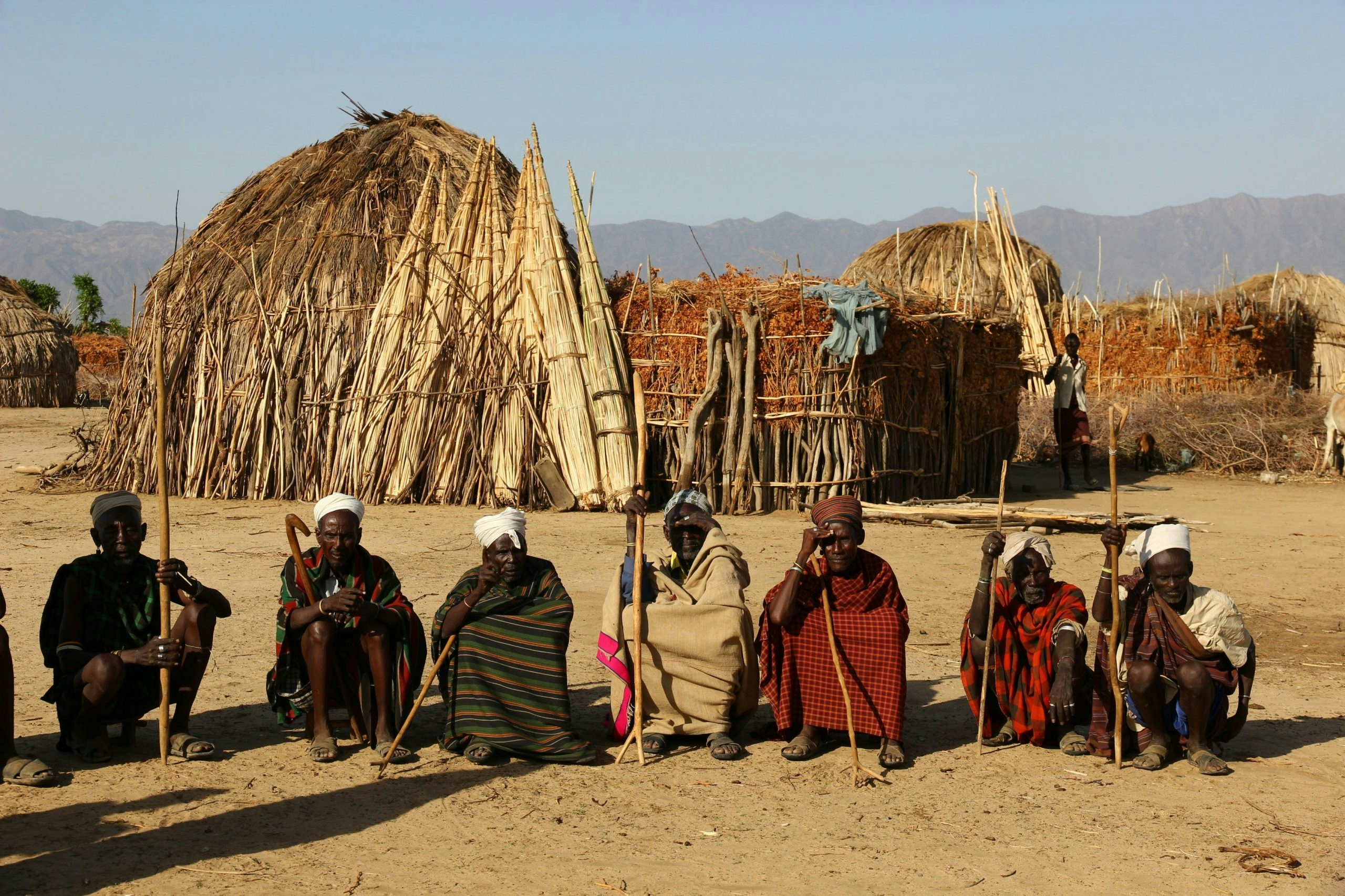 Group of Indigenous people wearing traditional clothing in rural Ethiopia