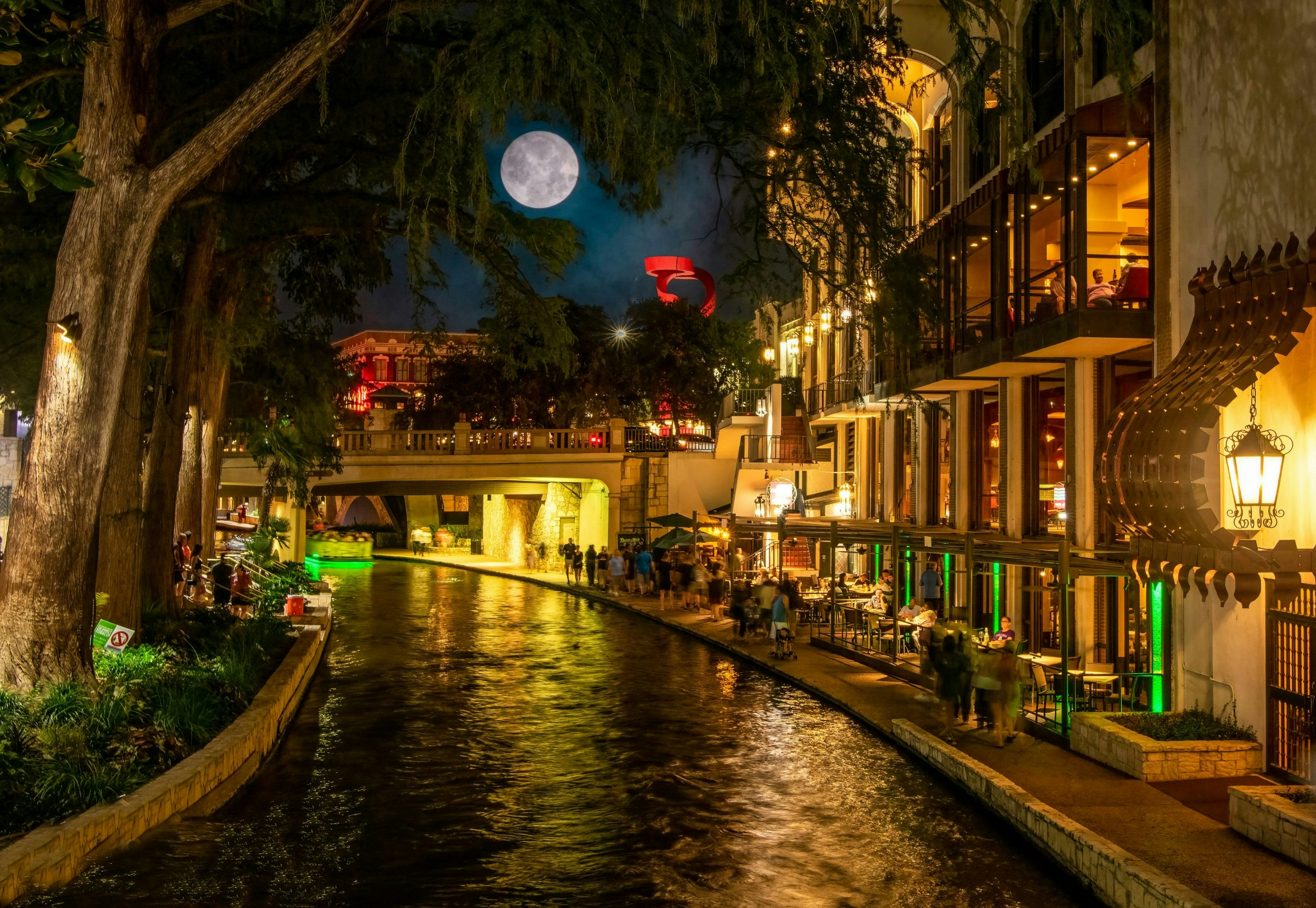 rban street scene in San Antonio featuring shops and historic buildings