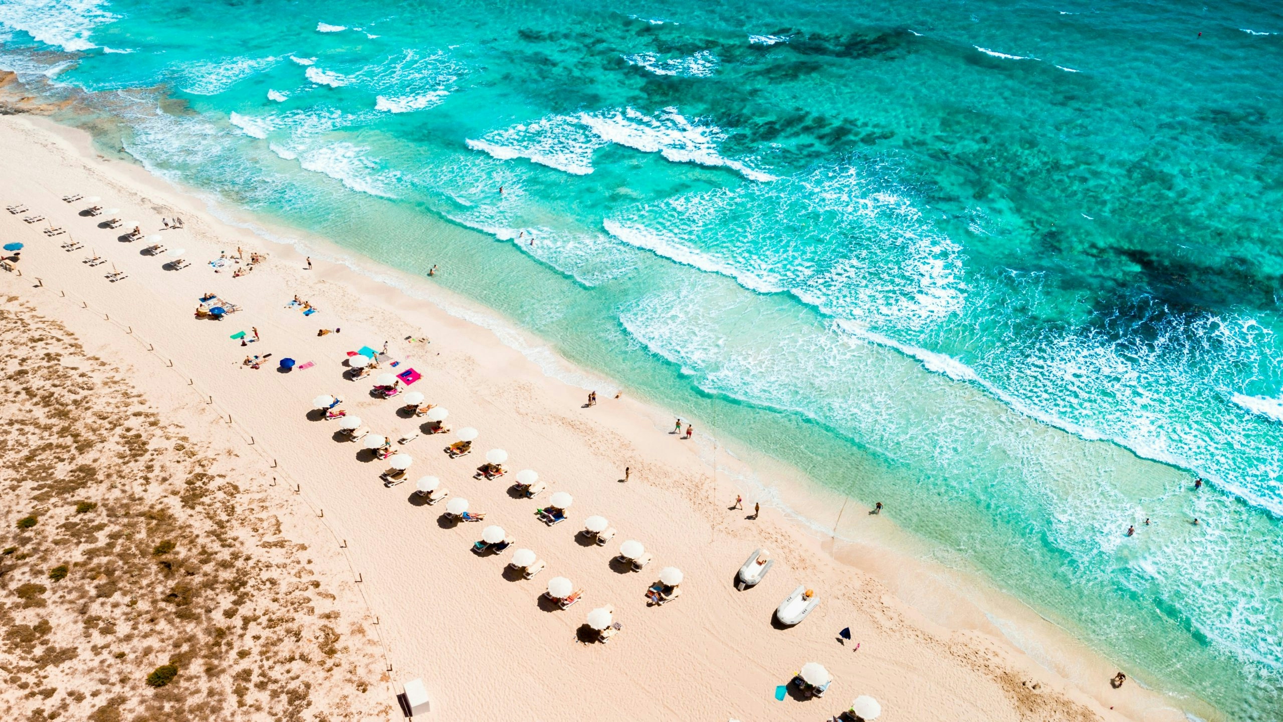 Crystal-clear beach in Ibiza with turquoise Mediterranean waters and soft white sand