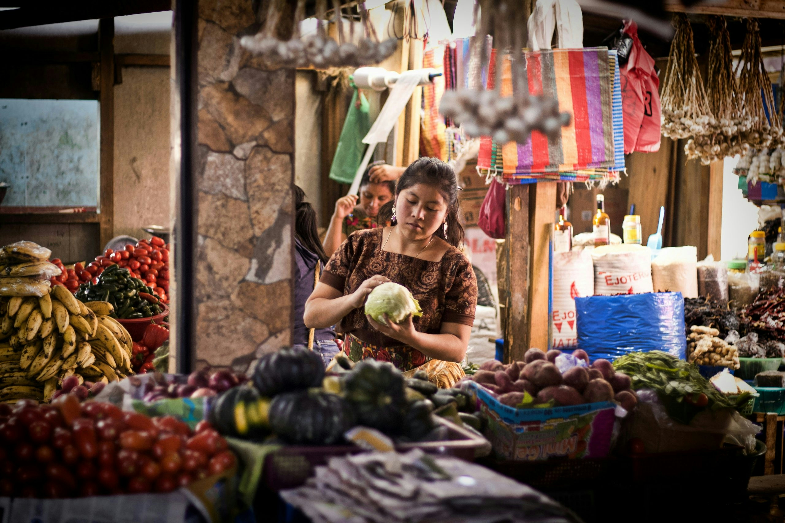 Bustling local market in Guatemala filled with colorful handmade goods