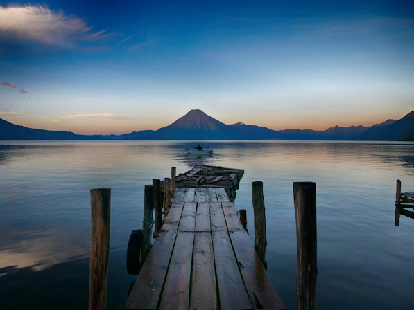 Panoramic view of Lake Atitlán surrounded by volcanic mountains in Guatemala