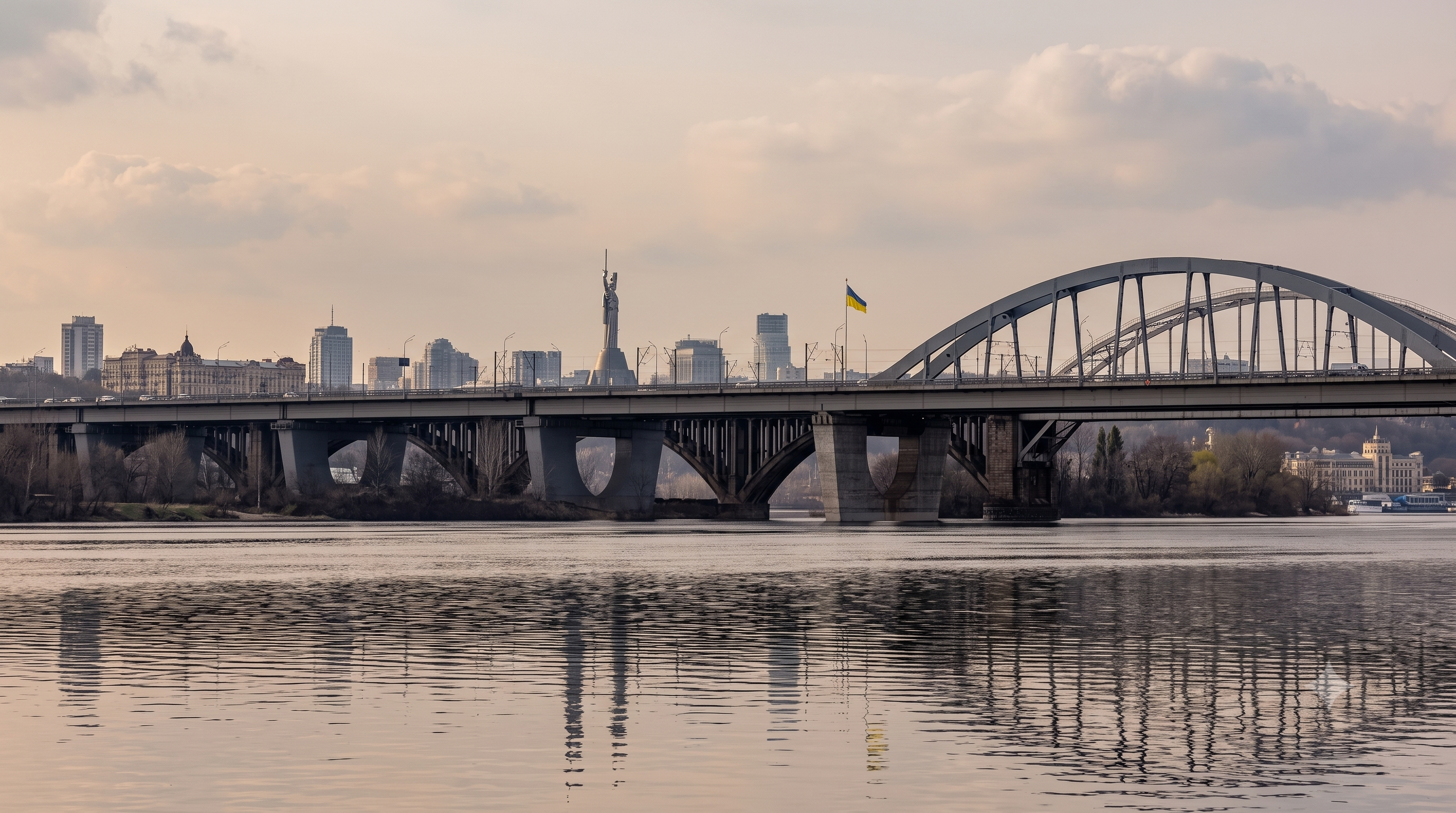 Panoramic view of Kyiv featuring the city's skyline and the Dnipro River.