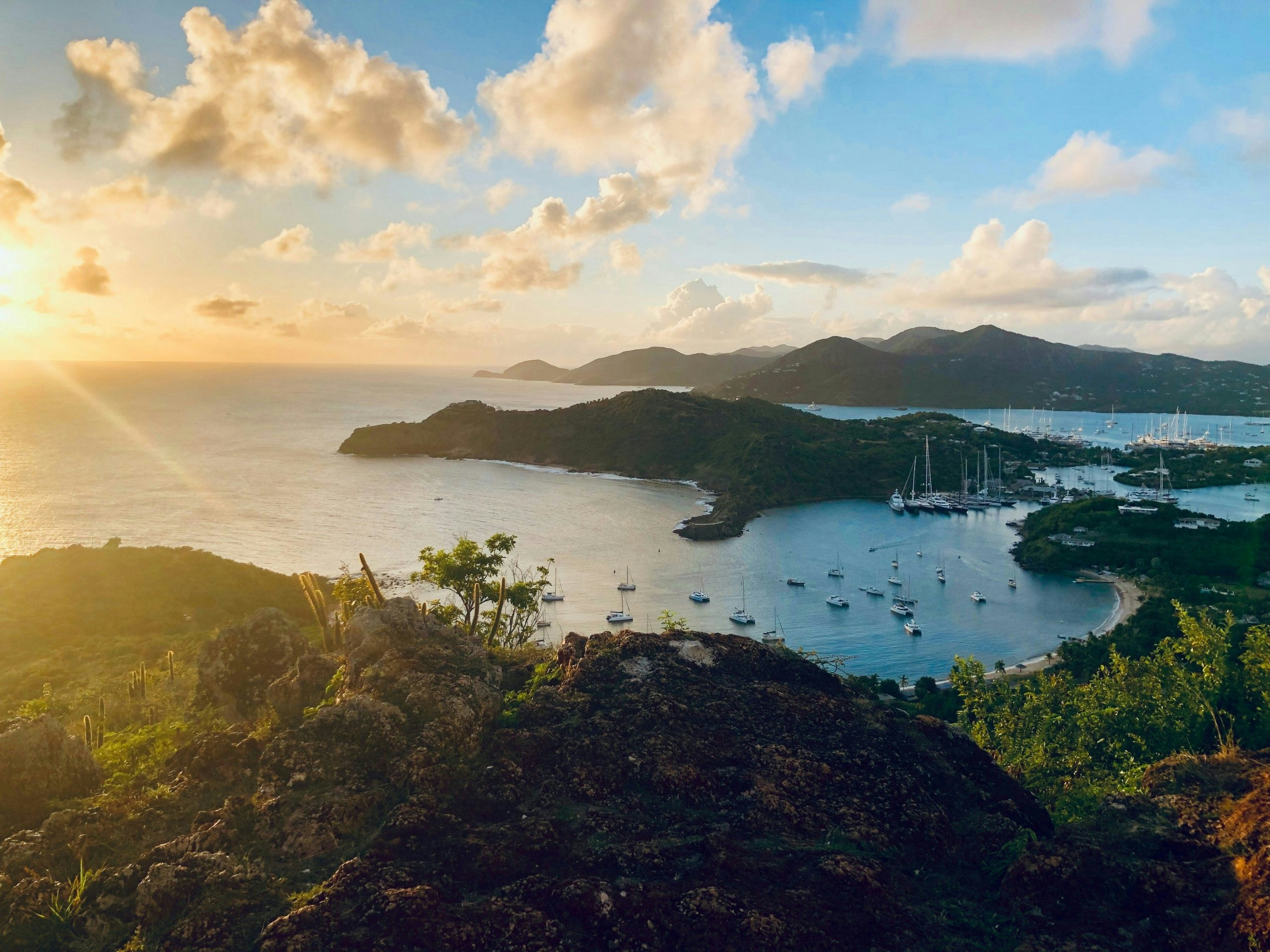 Aerial view of Antigua and Barbuda's turquoise coastline and tropical landscapes, featured in a Buy Weed in Antigua and Barbuda guide