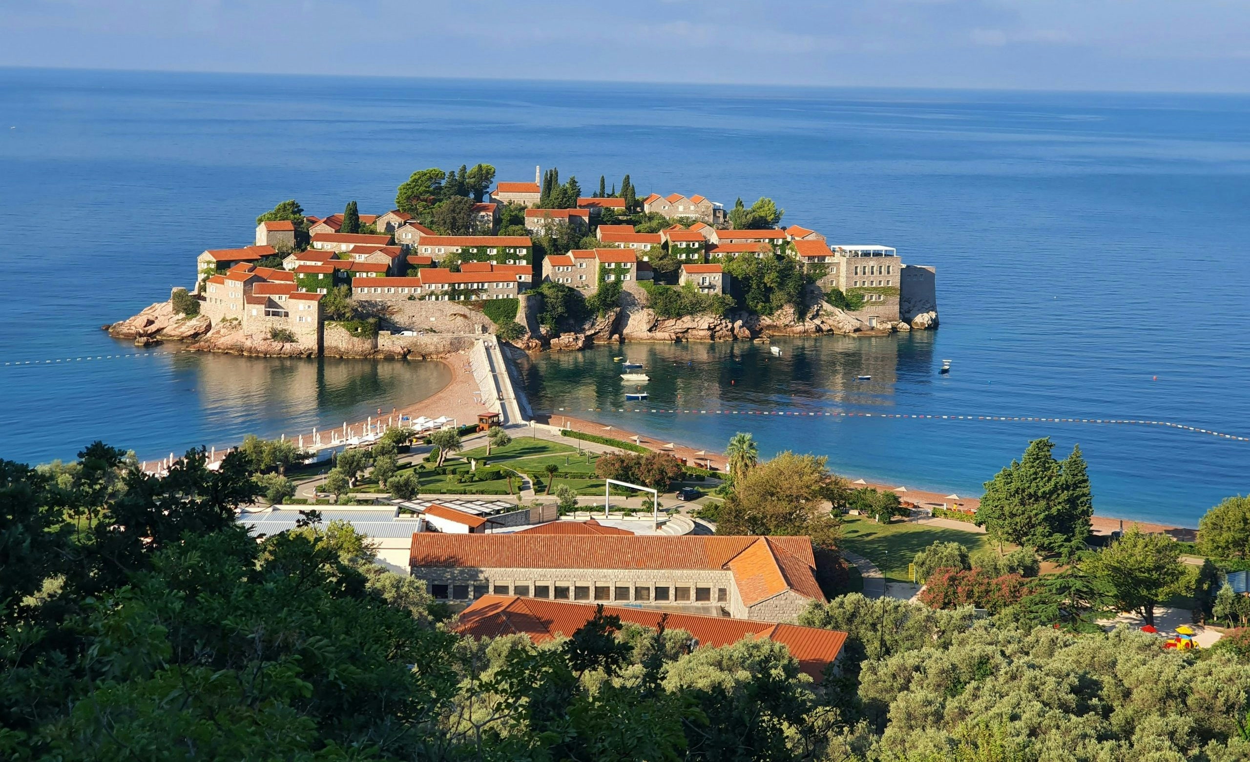 Scenic landscape in Montenegro featuring rugged mountains and crystal-clear waters.
