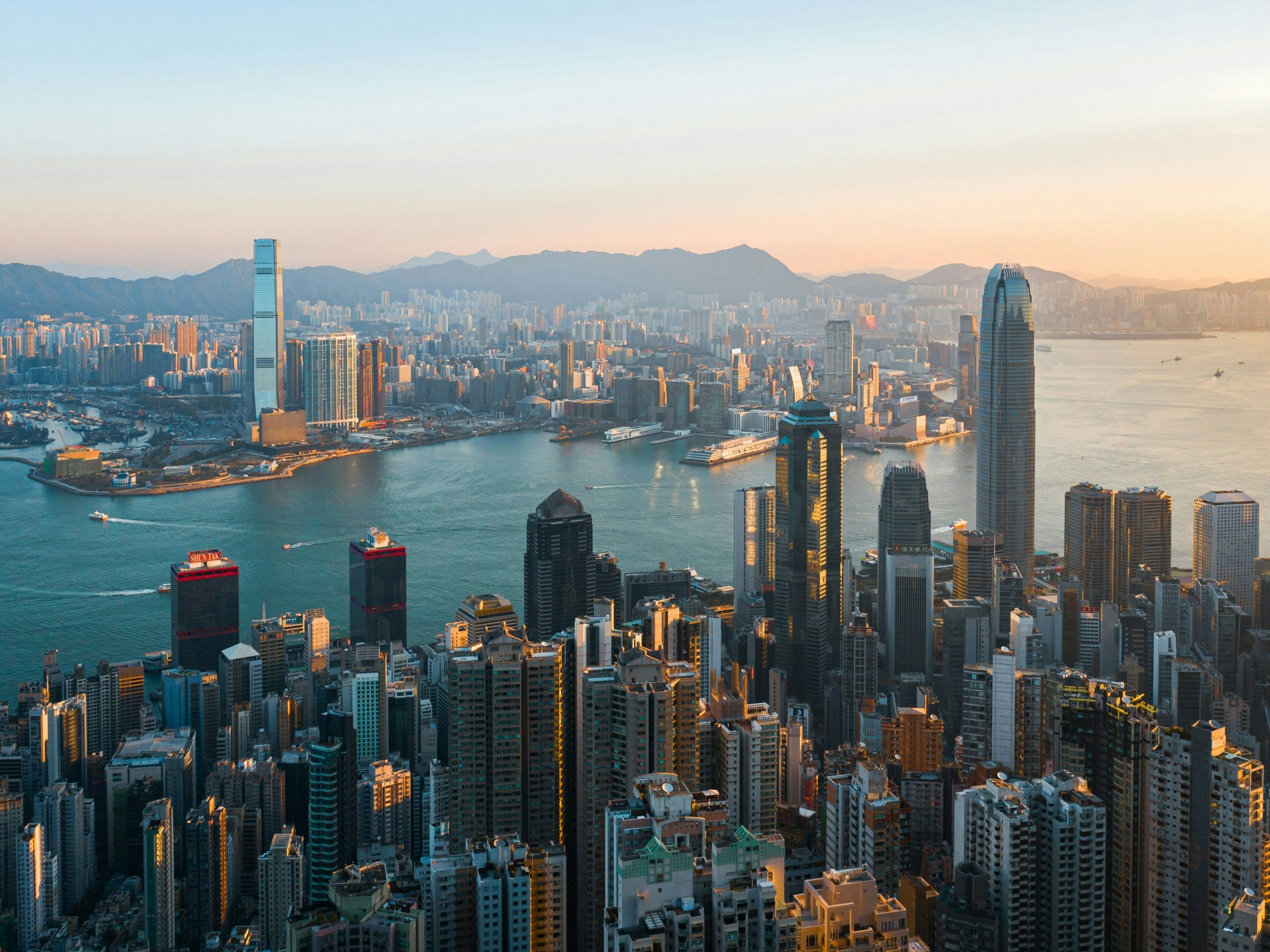 Panoramic view of Hong Kong's iconic skyline with densely packed high-rise buildings