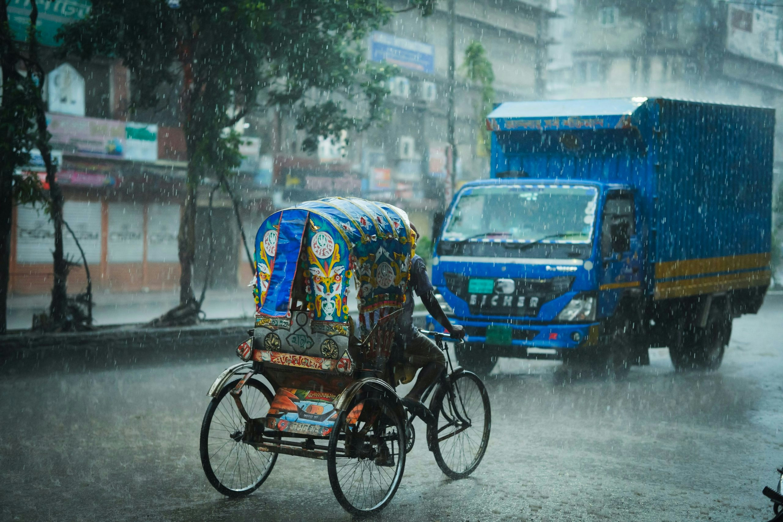 Cycle rickshaws transporting passengers in downtown Bangladesh