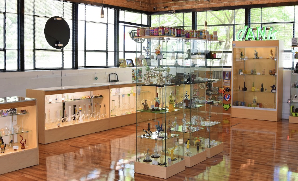 Interior of Sherlocks Glass dispensary featuring premium cannabis displays and a curated selection of the best exotic THCA flower