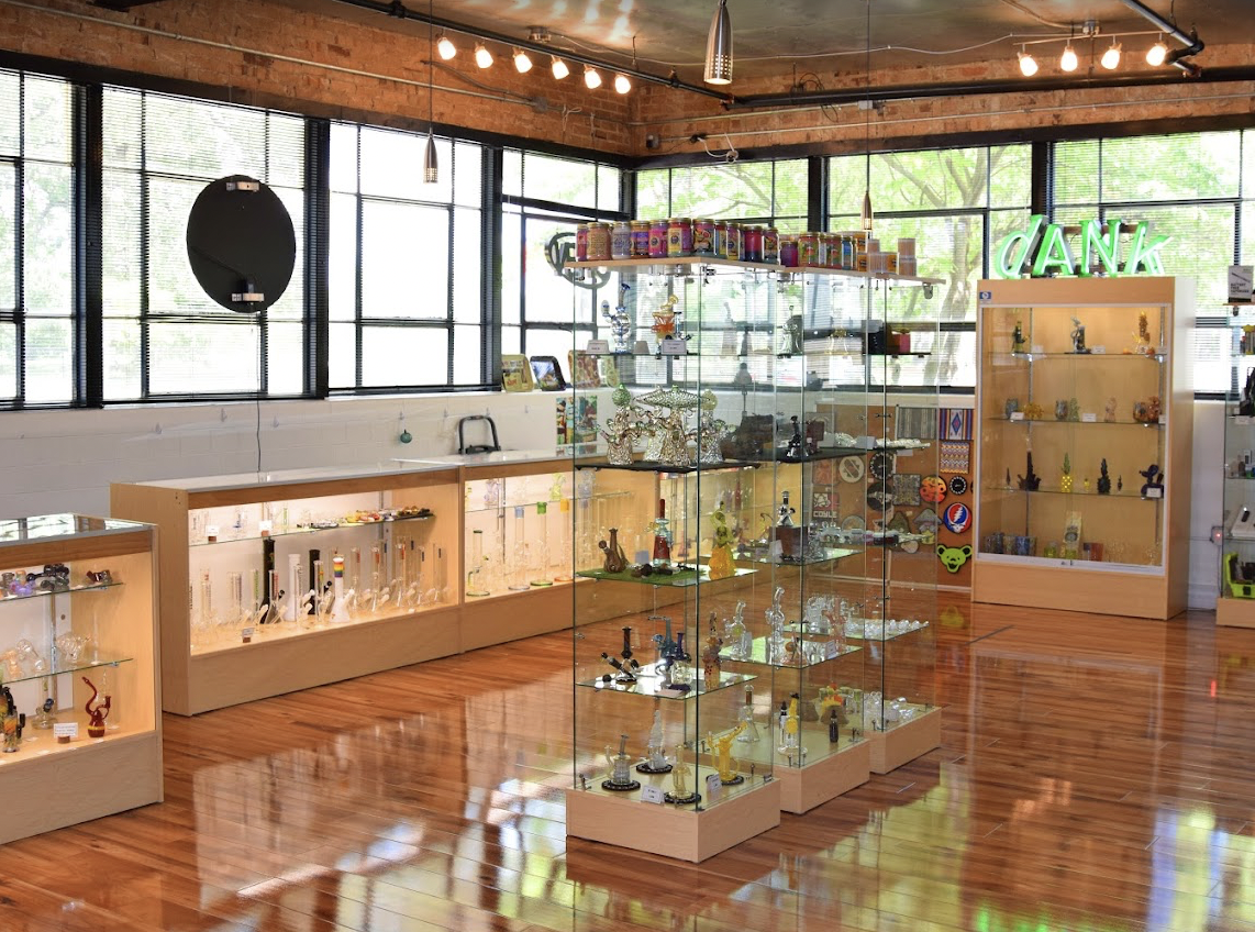 Interior of Sherlocks Glass dispensary featuring premium cannabis displays and a curated selection of the best exotic THCA flower