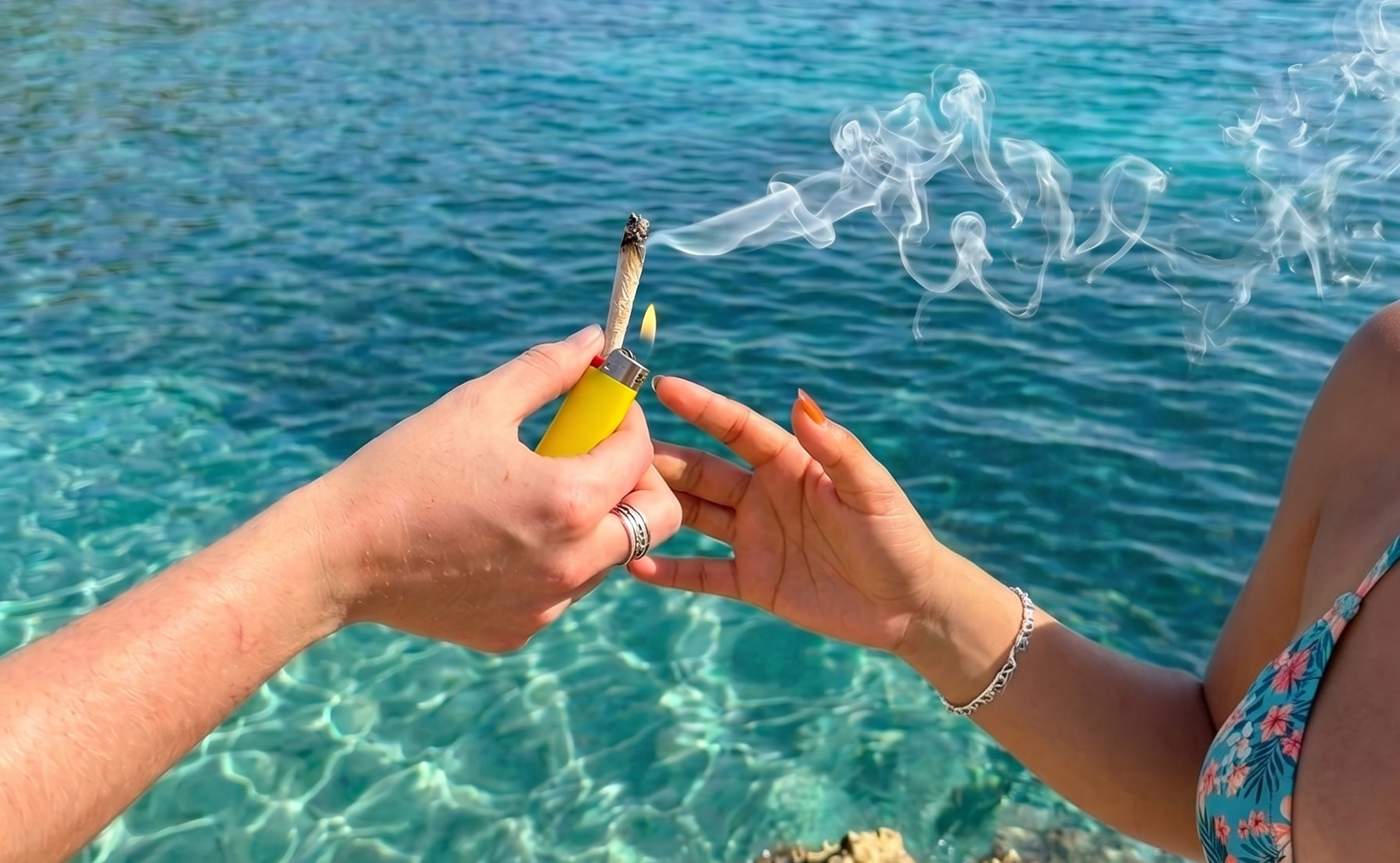 People smoking in the Famous limestone cliffs overlooking the Caribbean Sea in Negril, Jamaica."