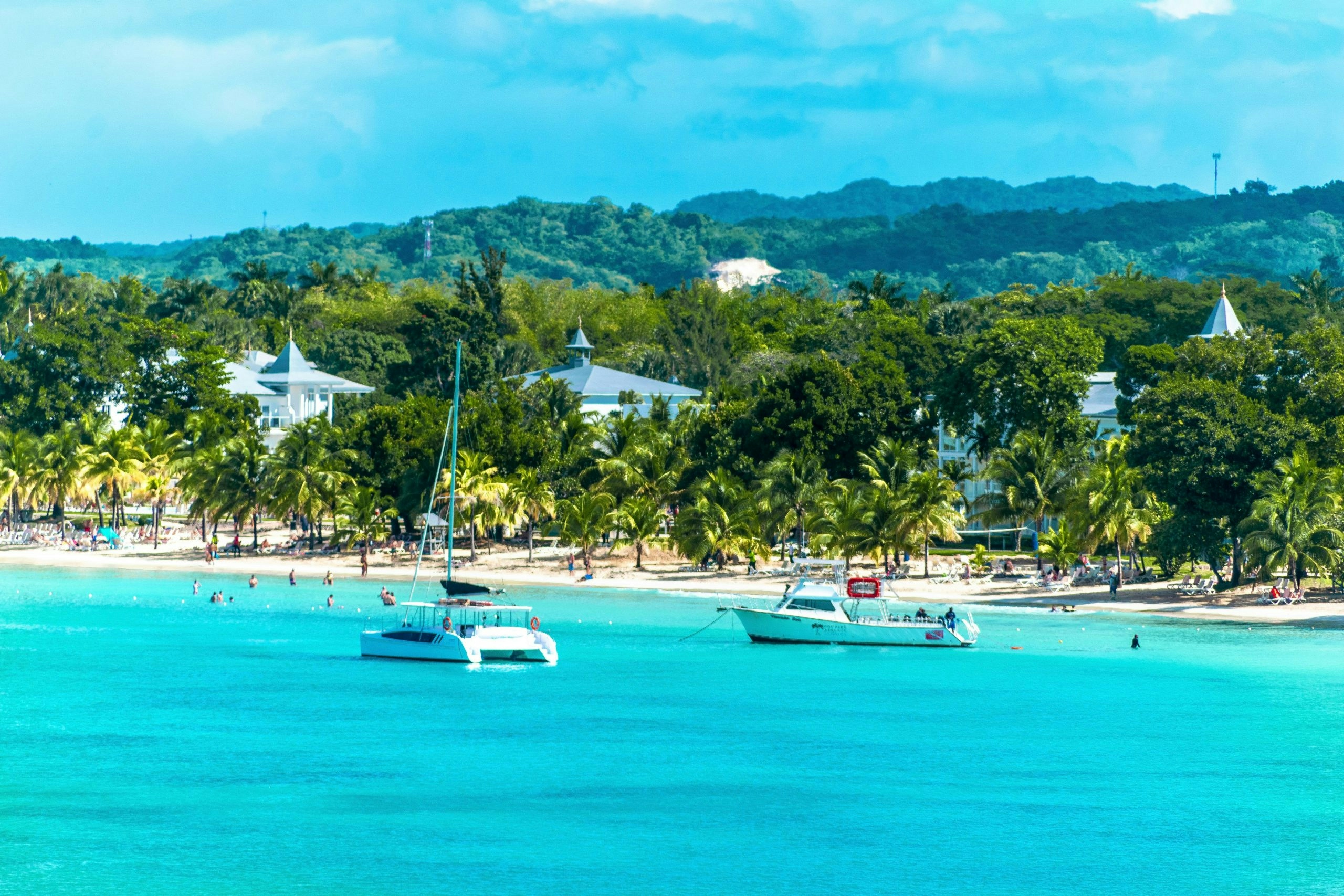 Relaxing beach view in Negril with calm Caribbean waters and sunny skies