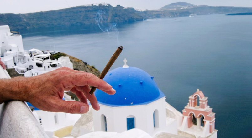 A traveler exploring Santorini while researching where to buy weed in Santorini