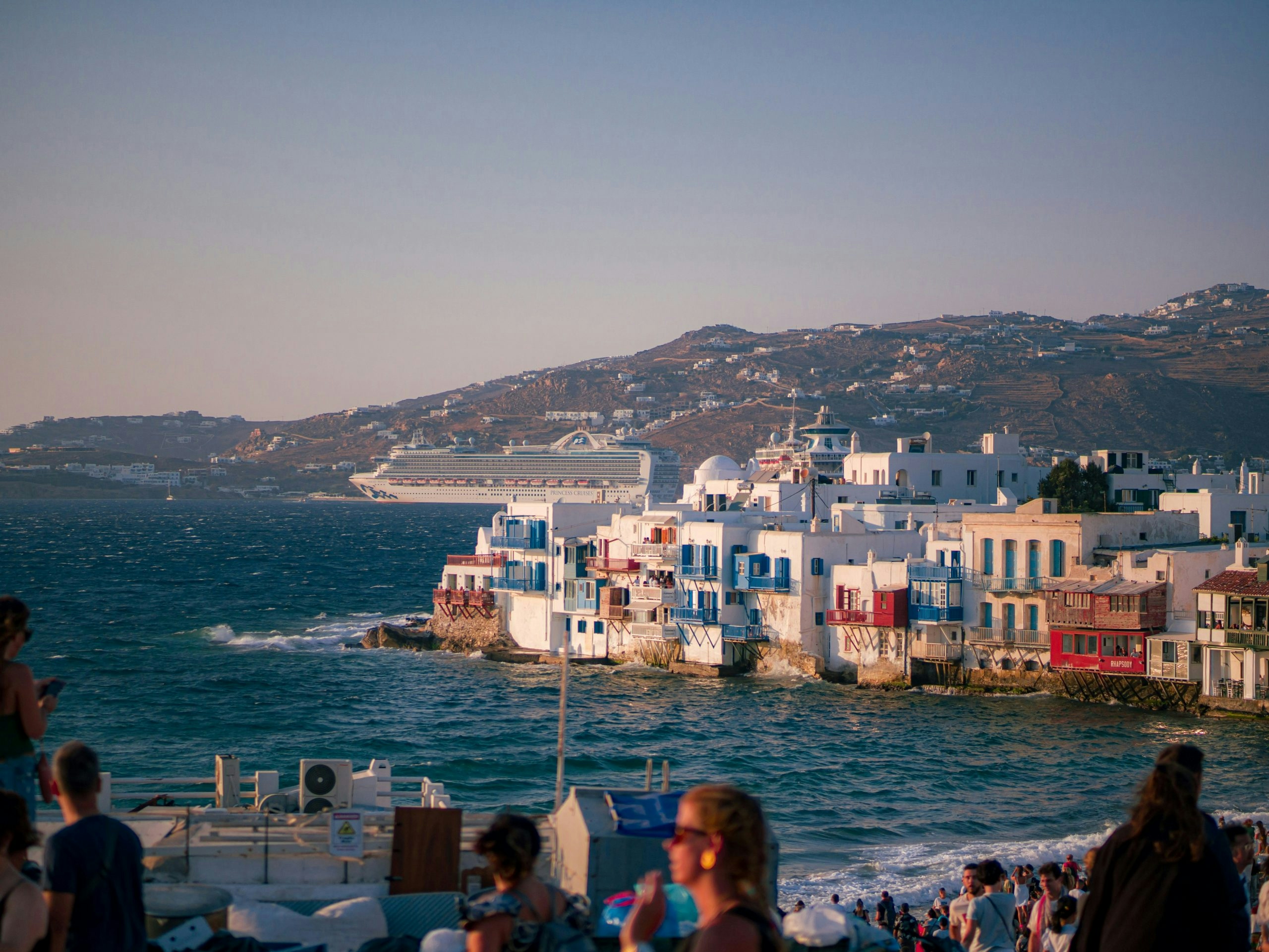 Picturesque street scene in Mykonos with colorful doors and balconies