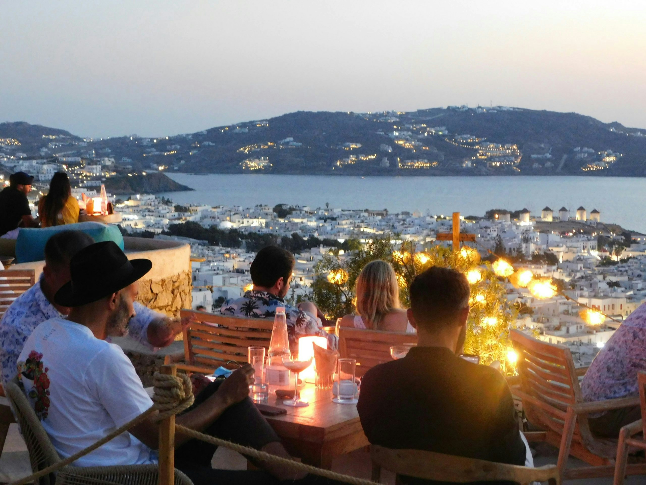 Visitors enjoying the vibrant atmosphere of Mykonos