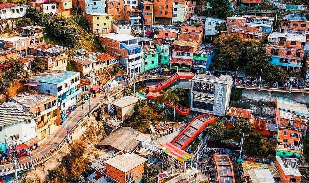 Colorful street art and outdoor escalators in Comuna 13, Medellín