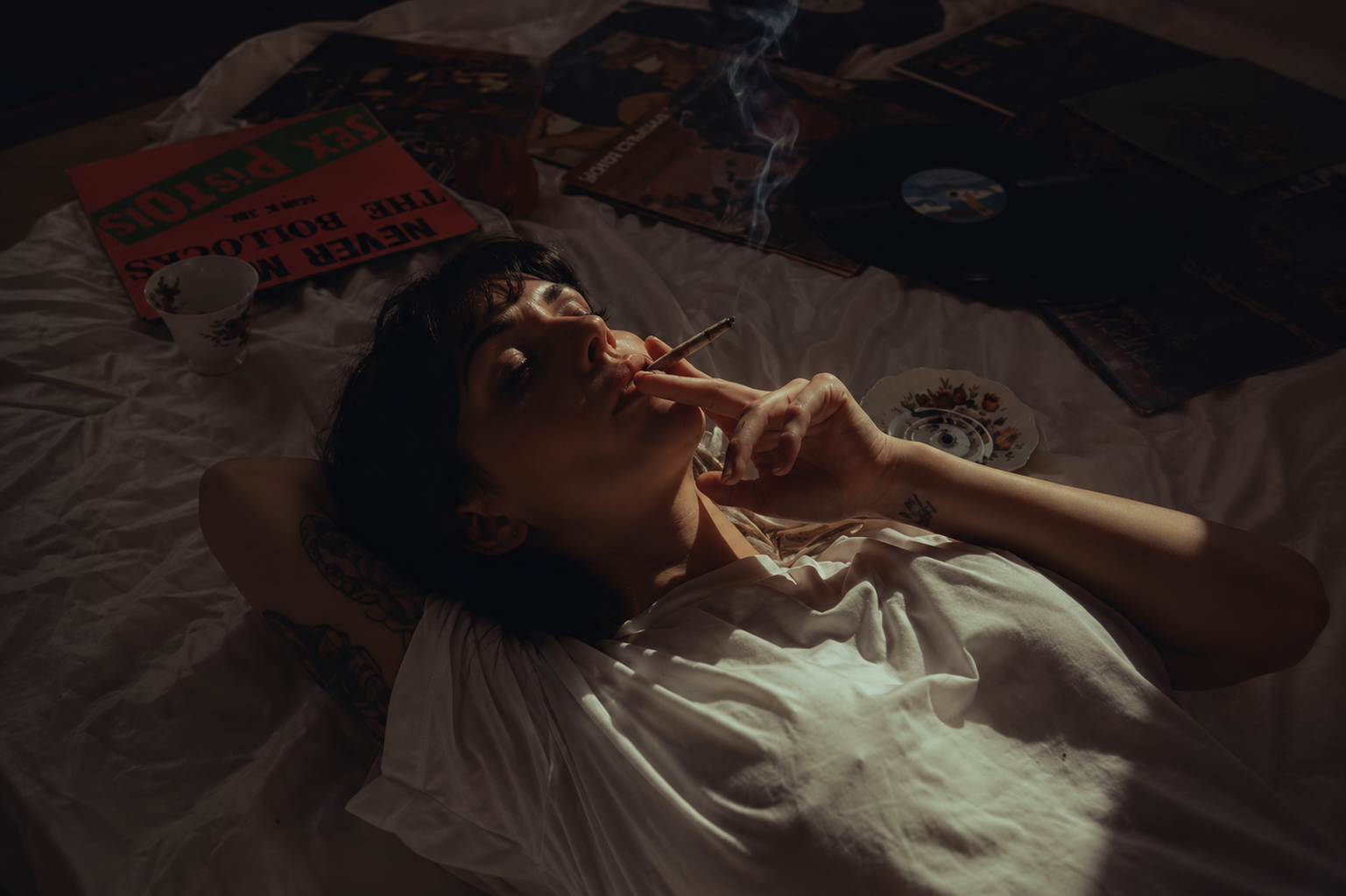 woman smoking a joint of pink runtz strain