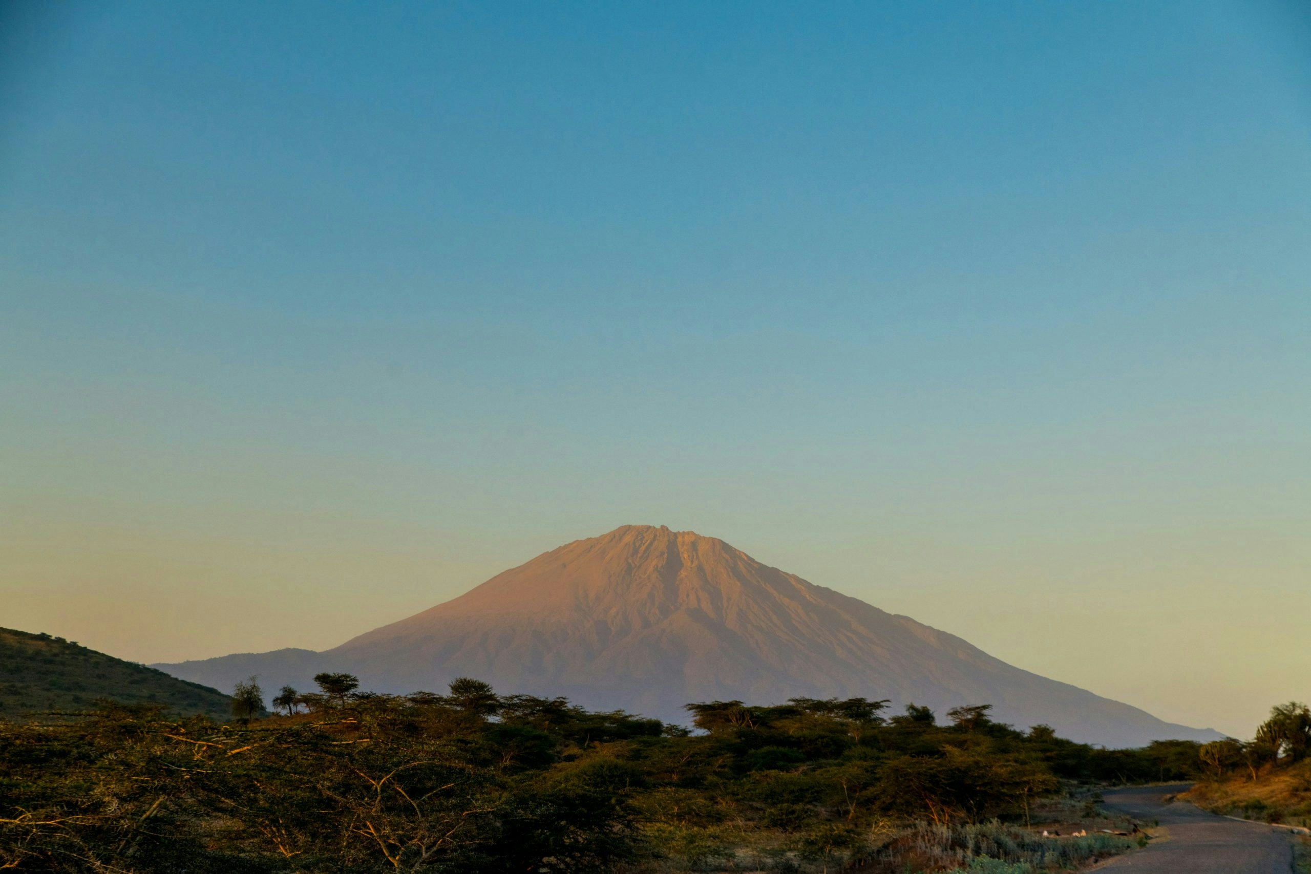 Mount Kilimanjaro rising above the surrounding plains in Tanzania
