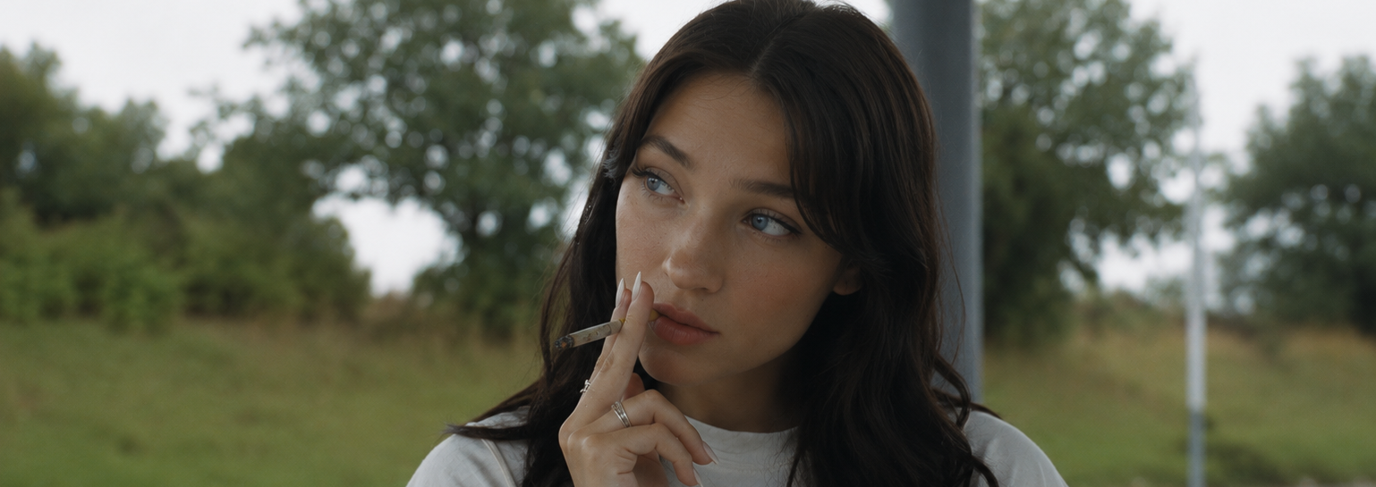 Woman smoking a hand-rolled cannabis joint