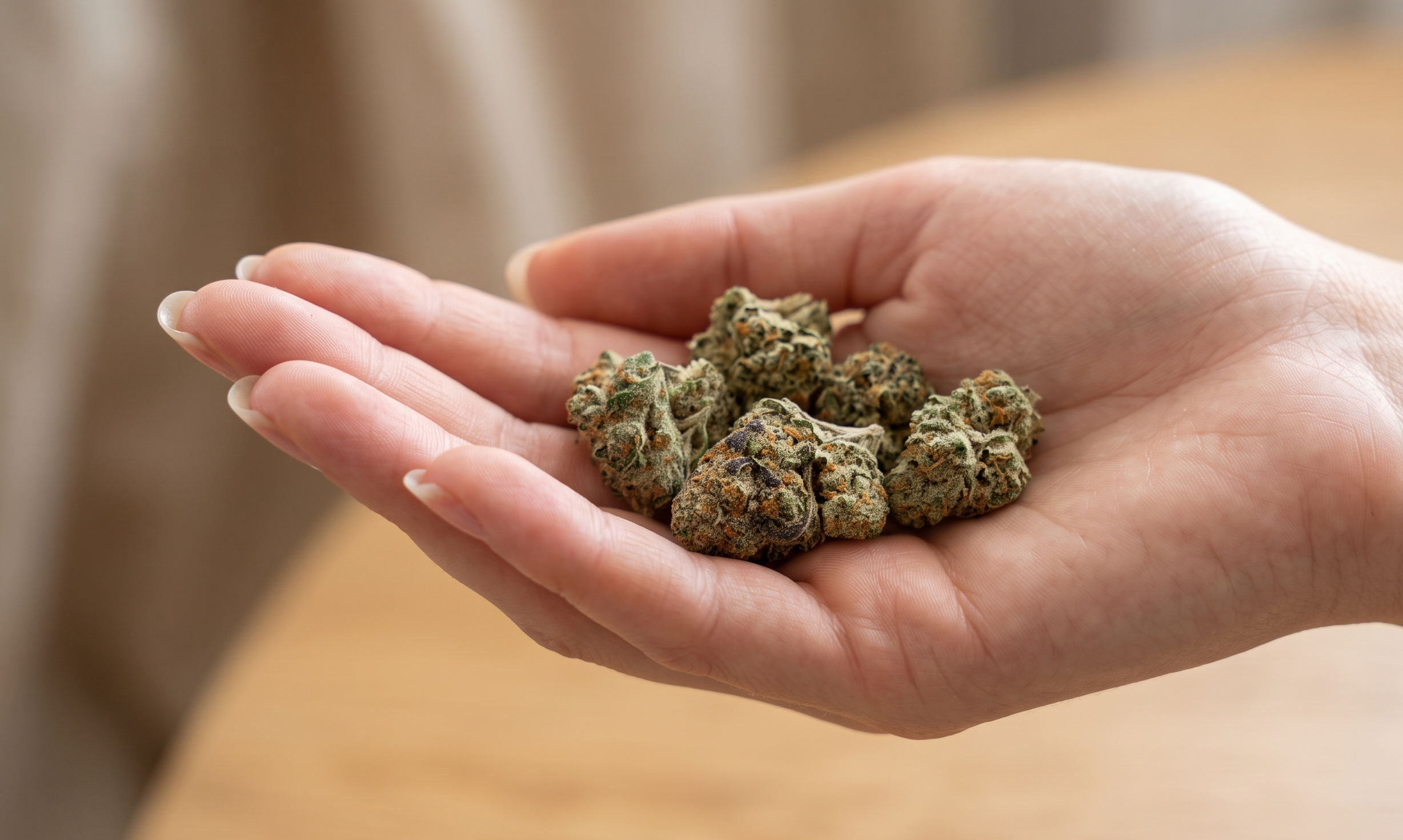 Macro photograph of frosted flakes cannabis buds highlighting dense resin coverage and flower structure