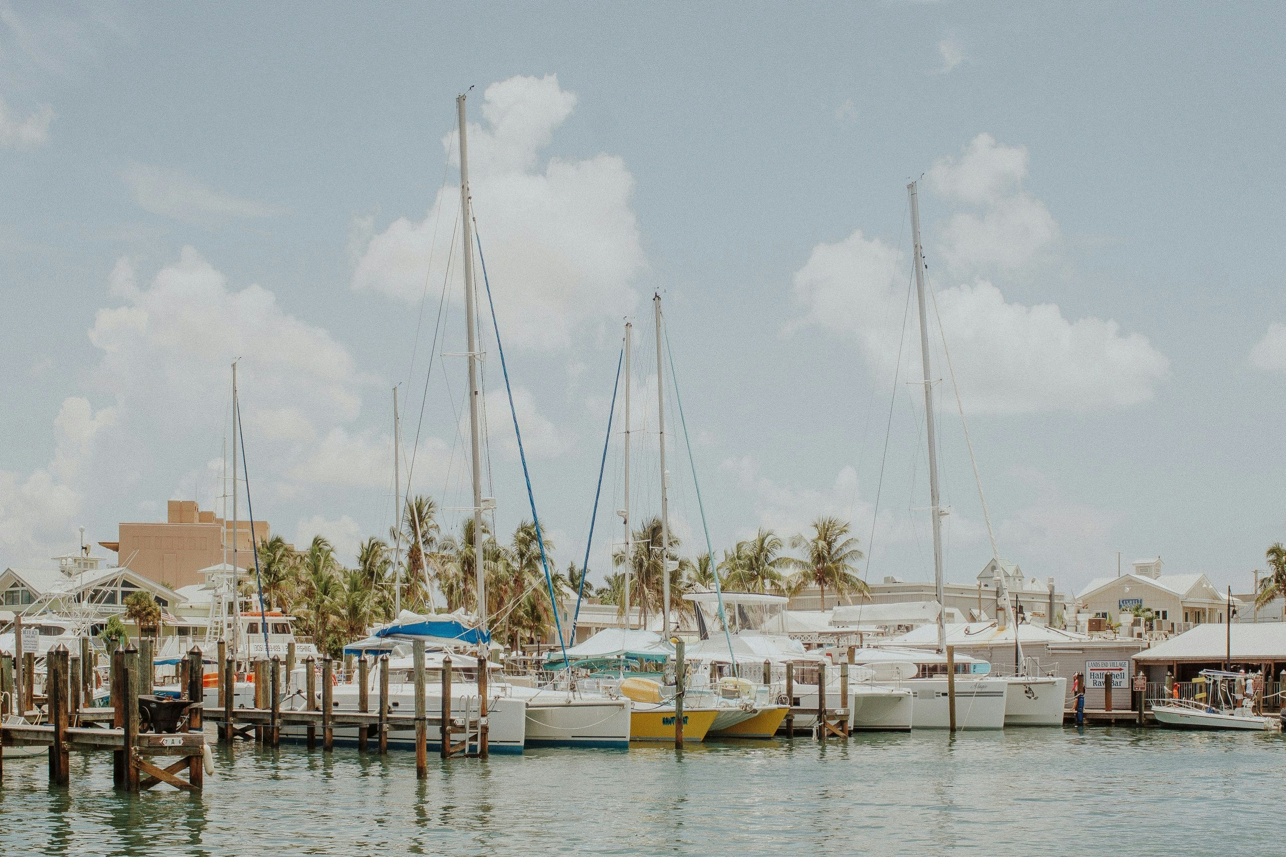Key West waterfront with boats, palm trees, and the clear waters surrounding the island