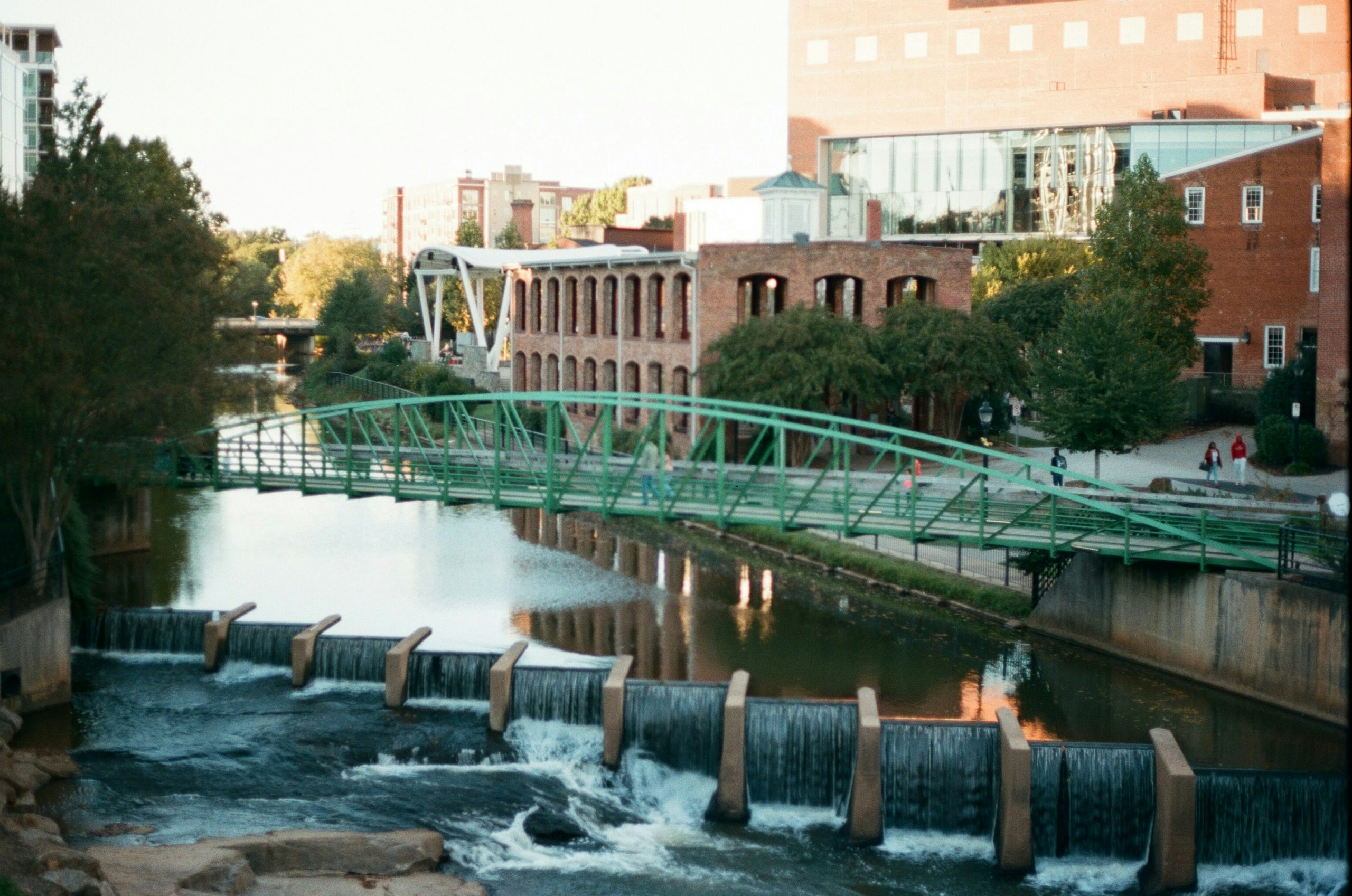 Downtown Greenville, South Carolina, with historic buildings, tree-lined streets, and a lively urban atmosphere