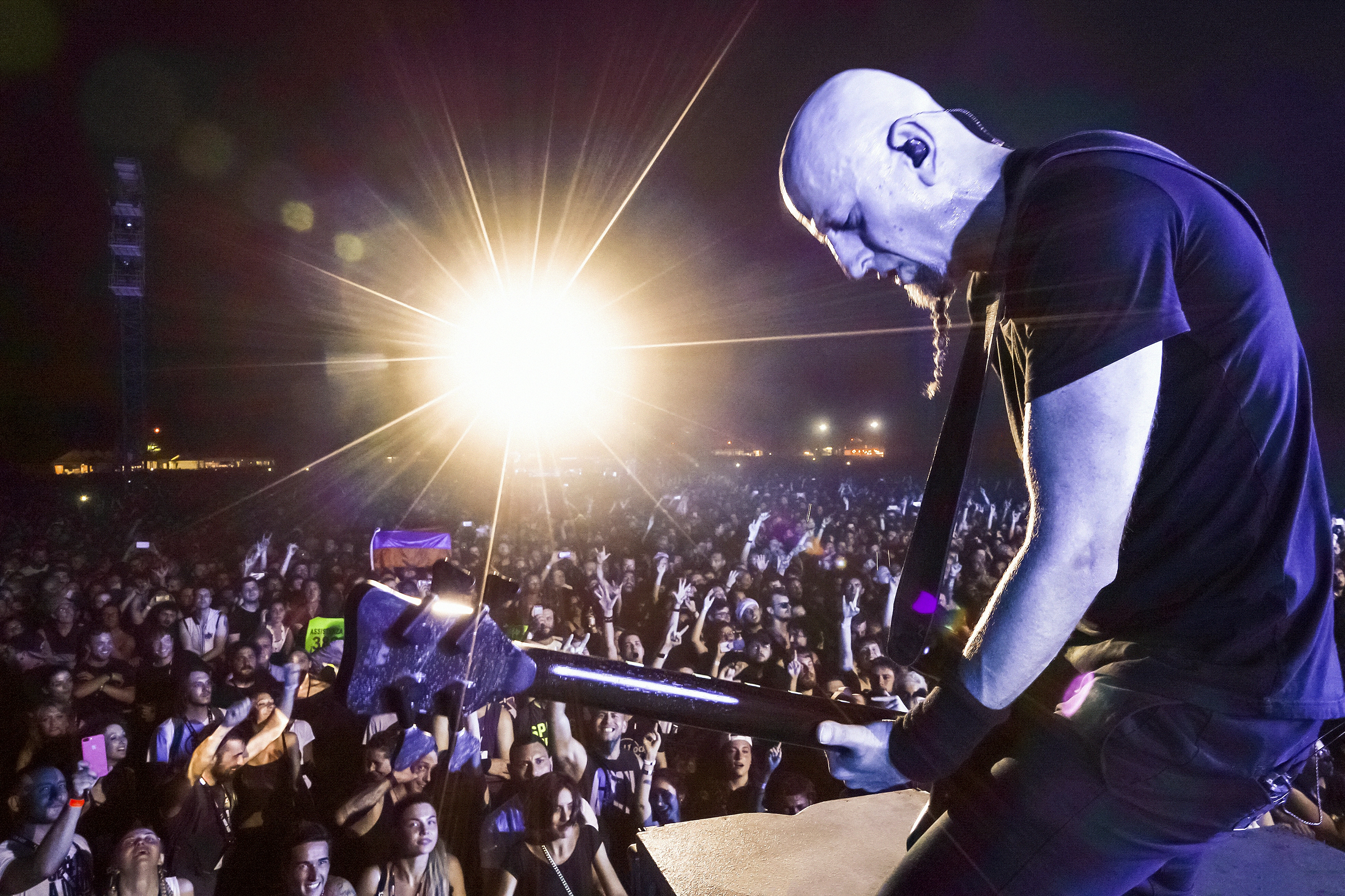 Live concert photo of Shavo Odadjian performing with his signature stage presence