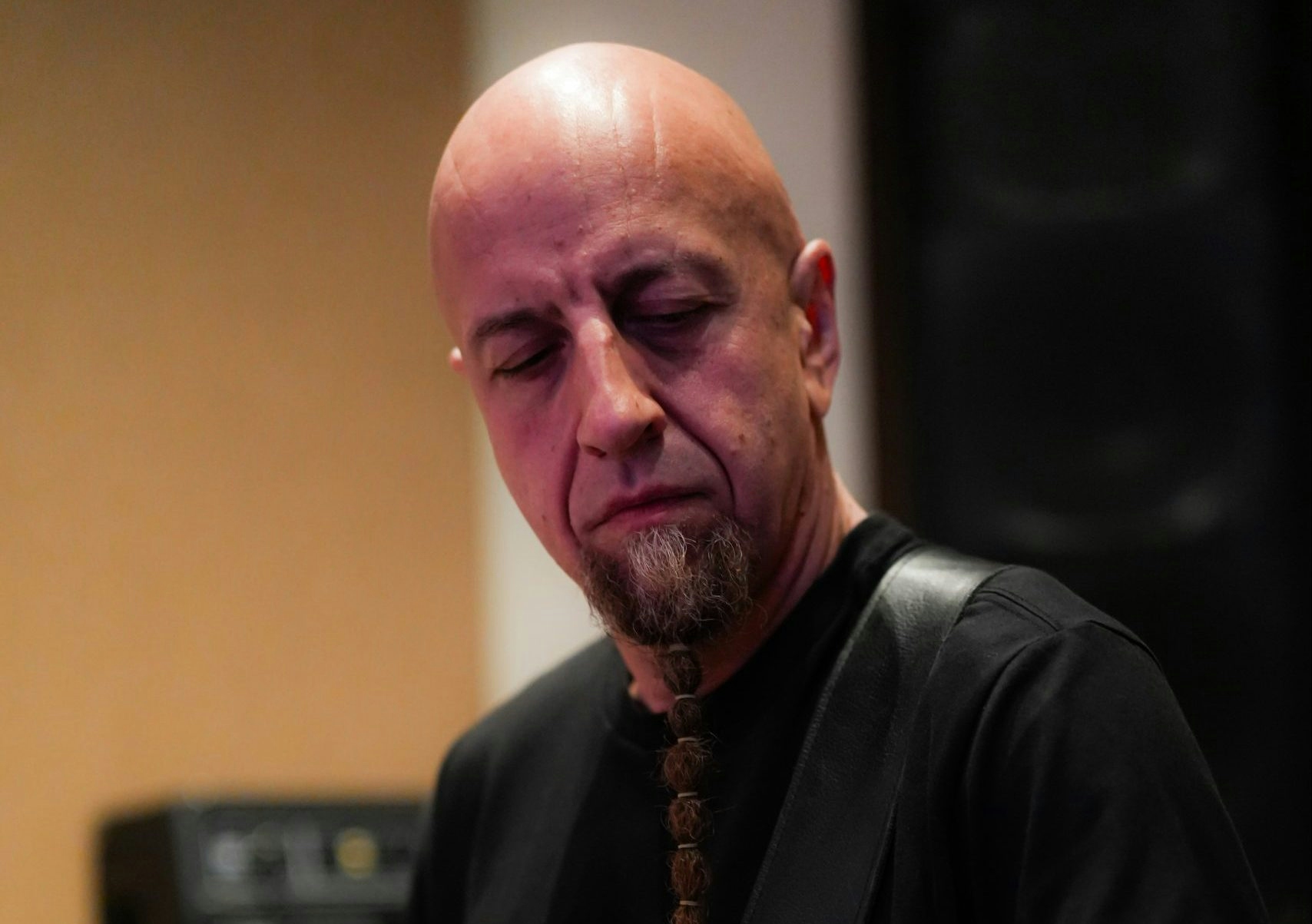 Close-up of Shavo Odadjian playing bass