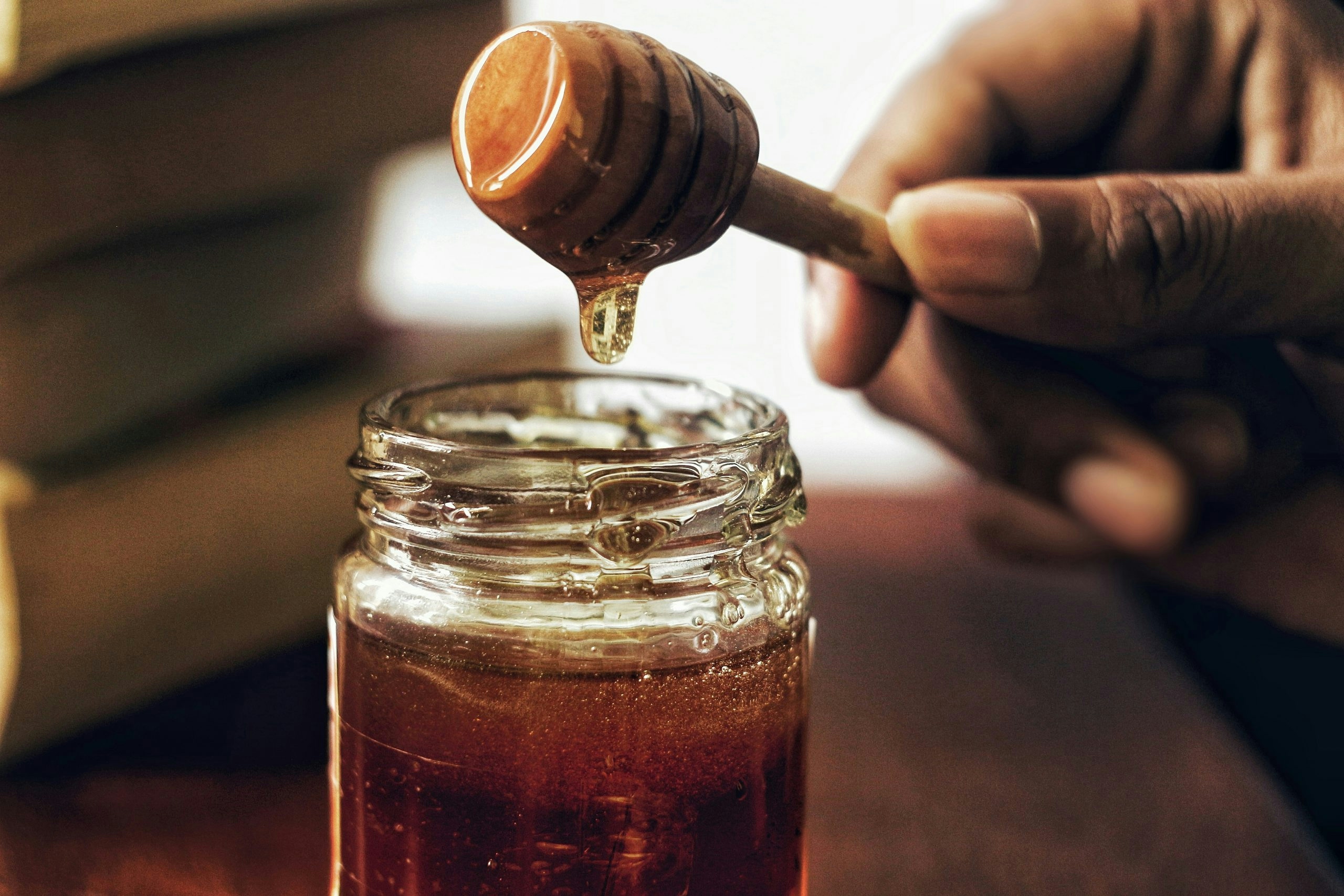 Golden THC simple syrup in a clear bottle ready for use