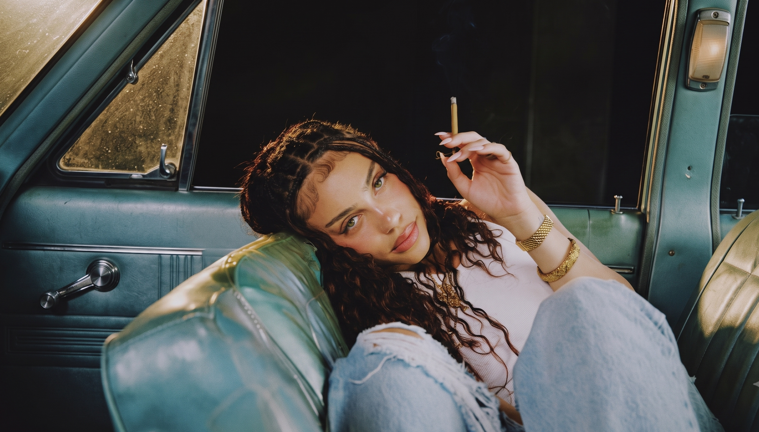 Beautiful woman holding a hand-rolled cannabis joint