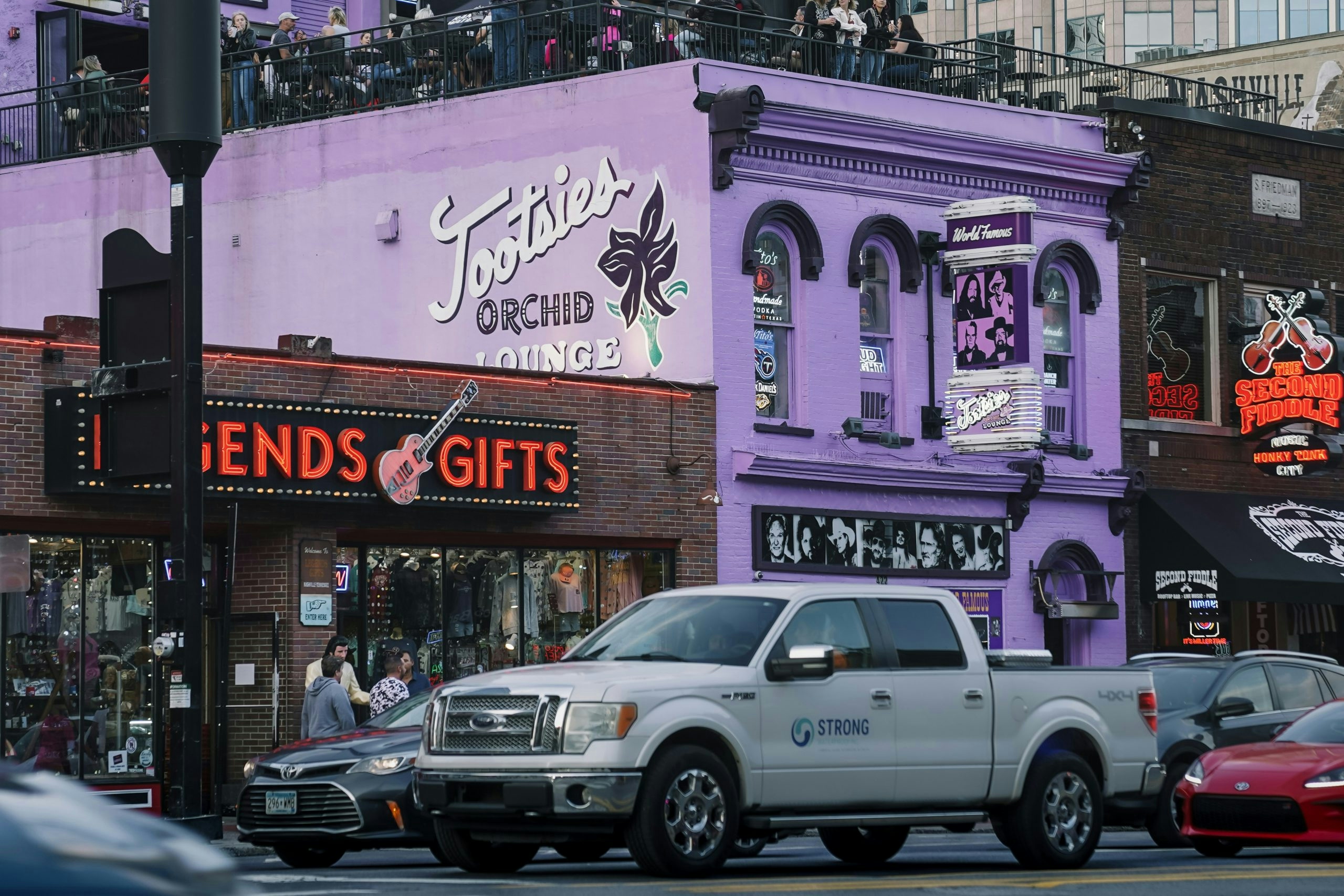 Neon signs illuminating Nashville's famous Broadway entertainment district.