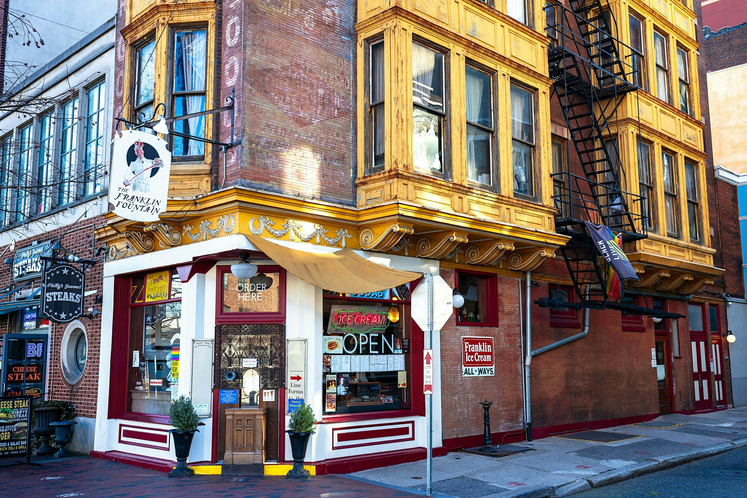Corner storefront on a busy street in downtown Philadelphia