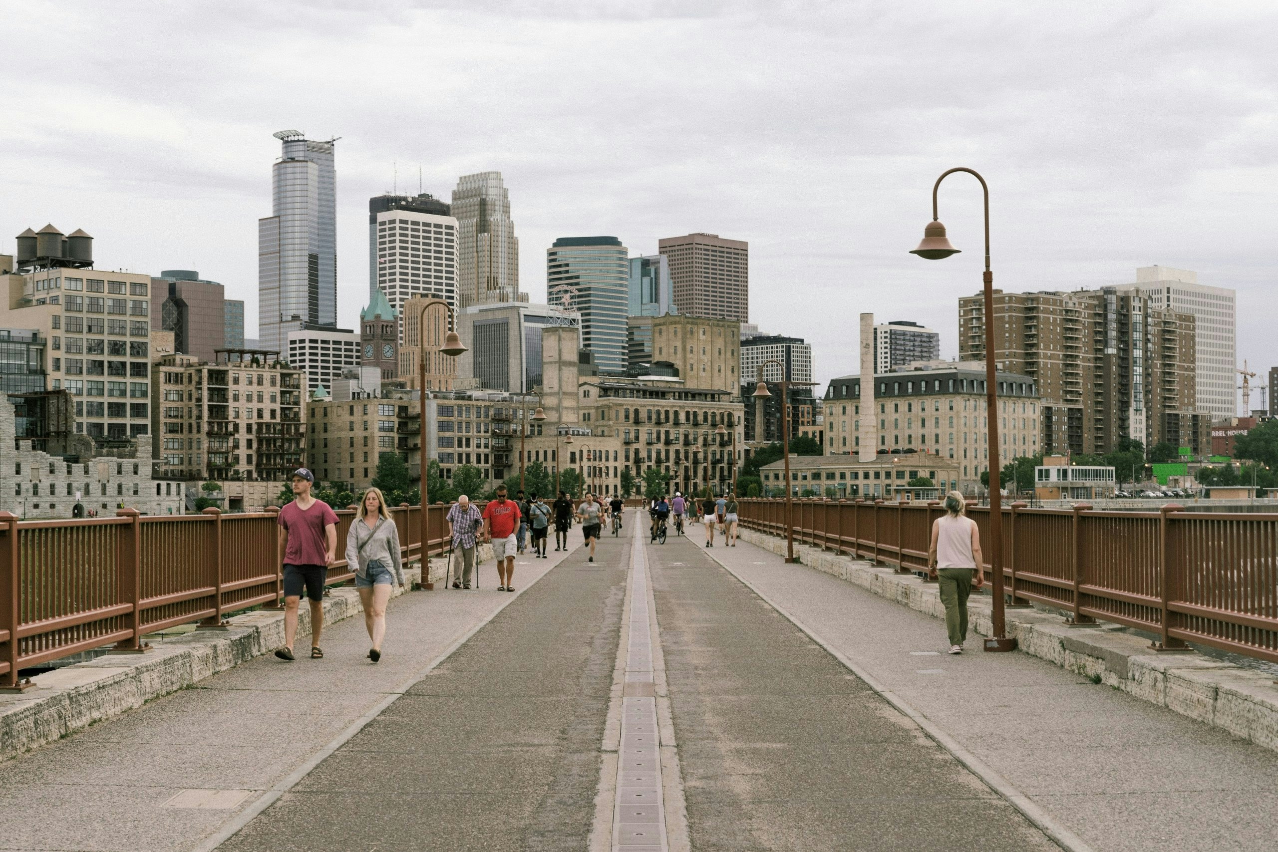 Locals walking through a Minnesota city sidewalk