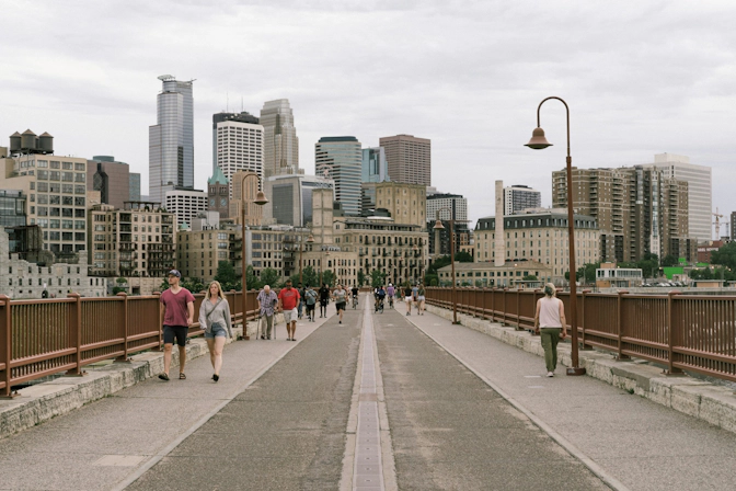 Locals walking through a Minnesota city sidewalk