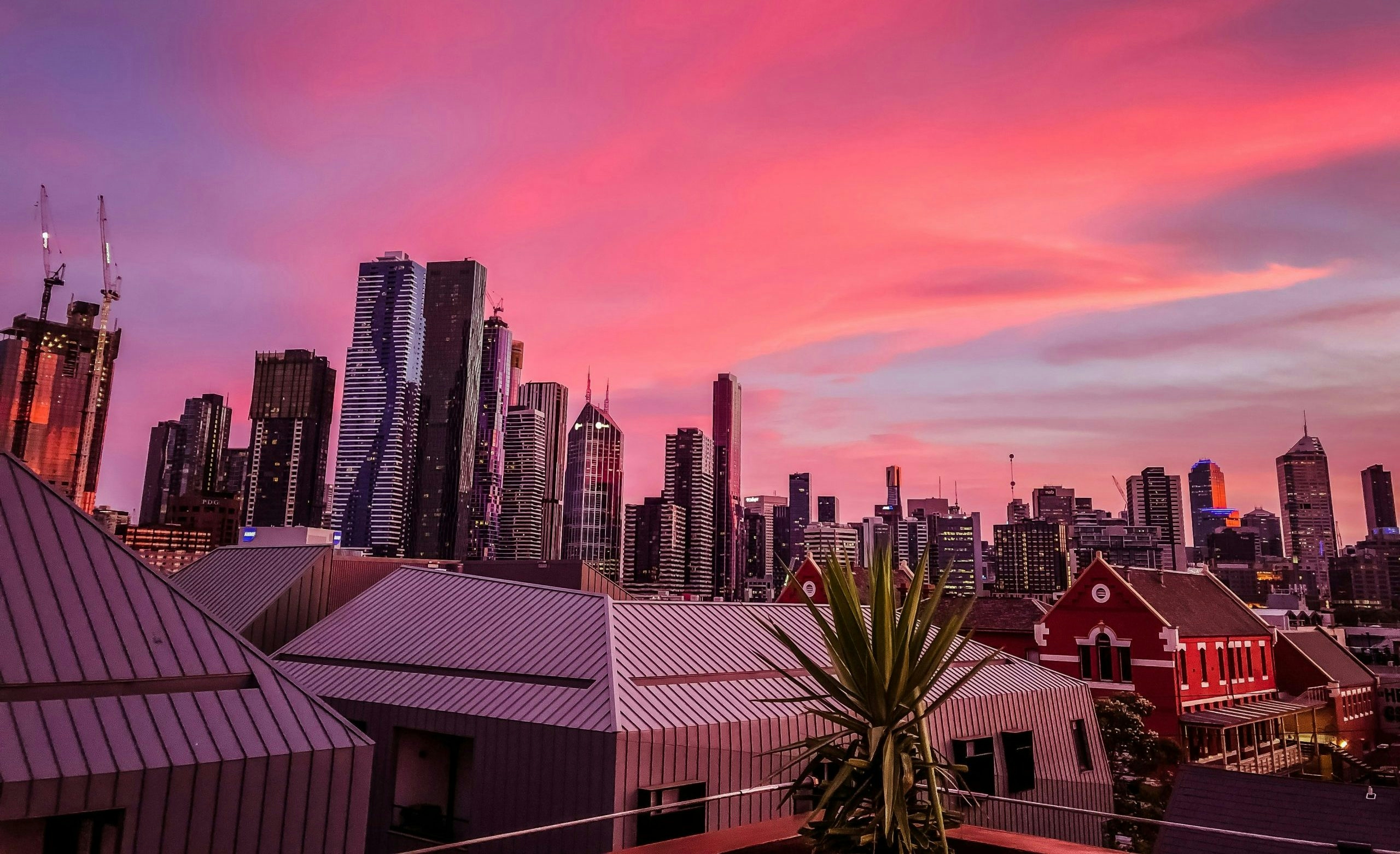 Colorful sunset illuminating Melbourne's city skyline